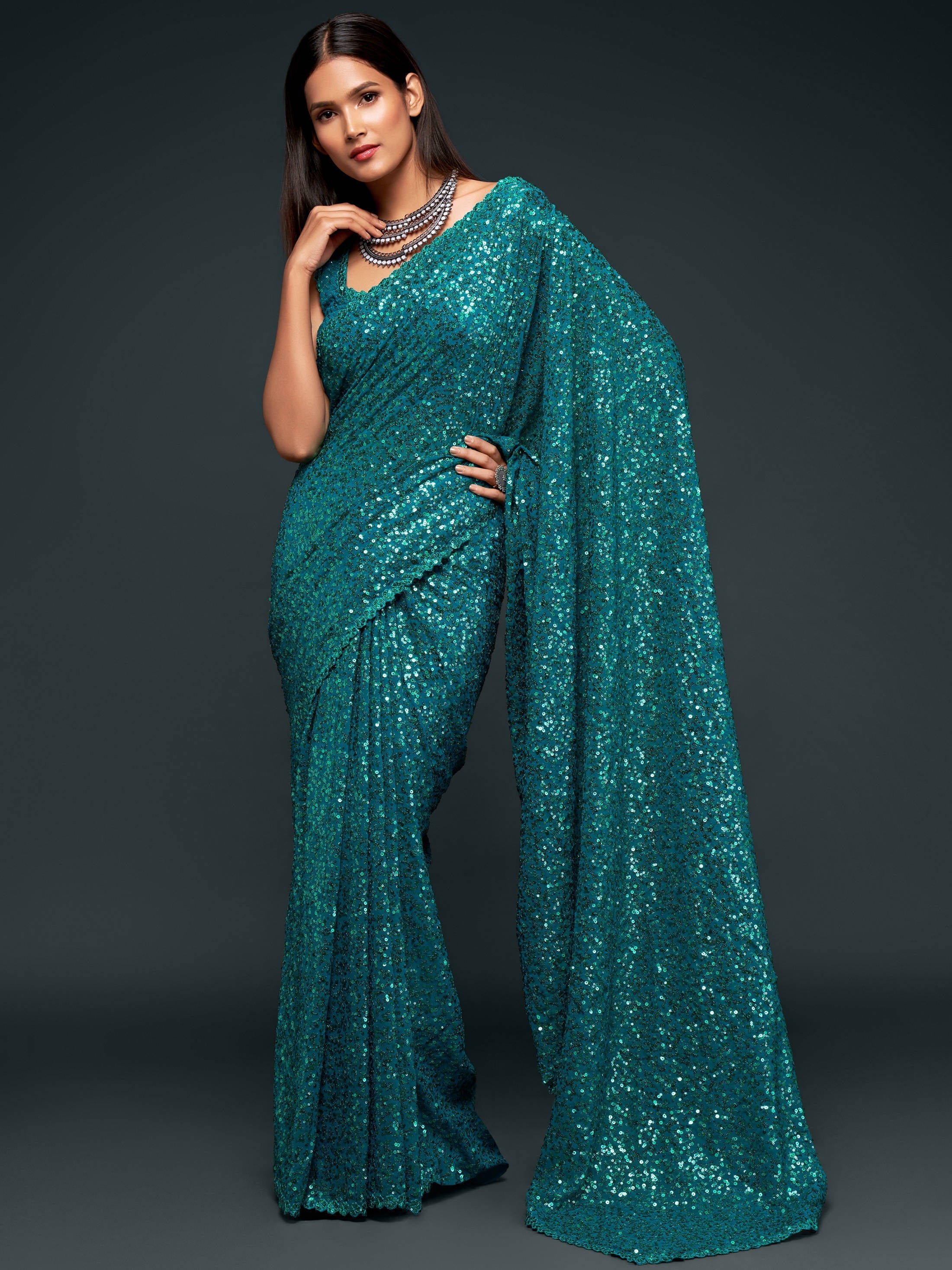 Attractive Teal  Blue Sequined Georgette Party Wear Saree