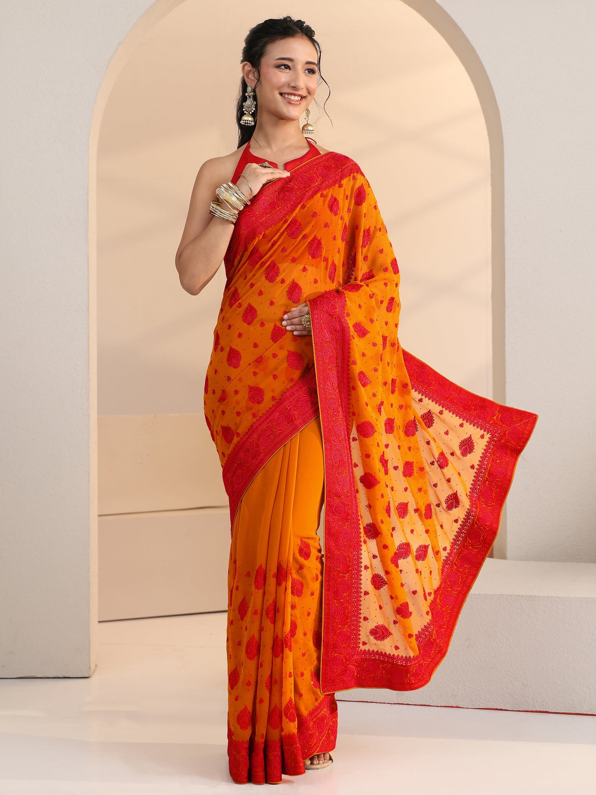 Anouk Pulp Orange Georgette Saree with Embroidered Border