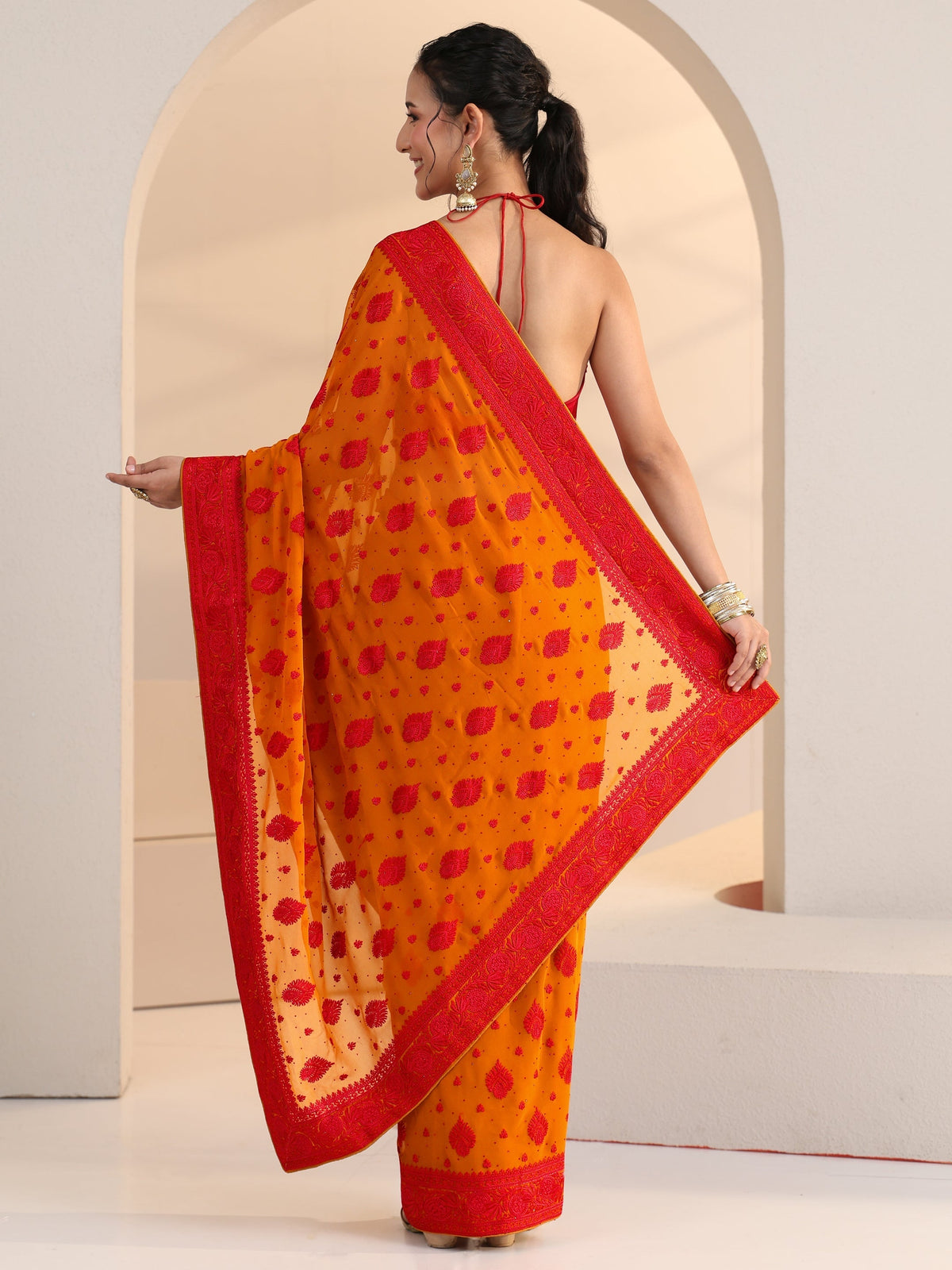 Anouk Pulp Orange Georgette Saree with Embroidered Border
