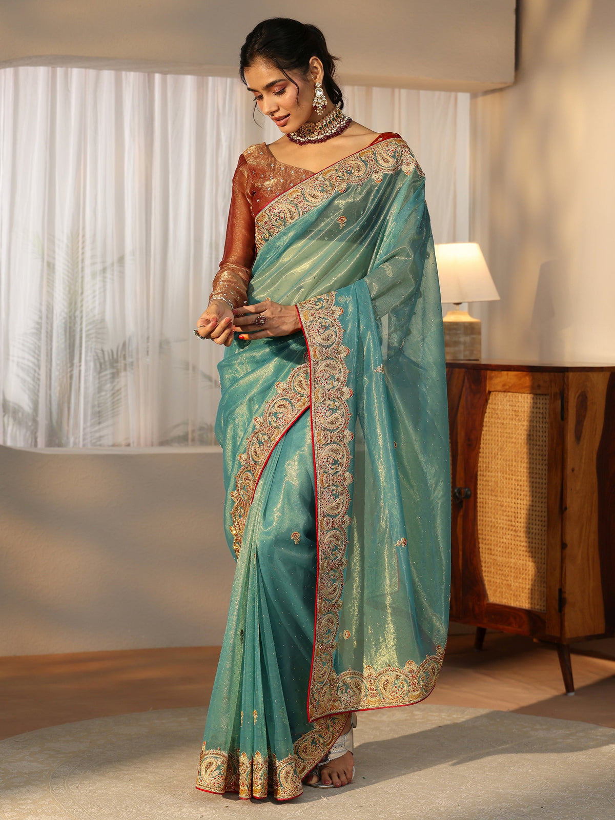 Anouk Aqua Blue Net Saree with Embellished Paisley Border