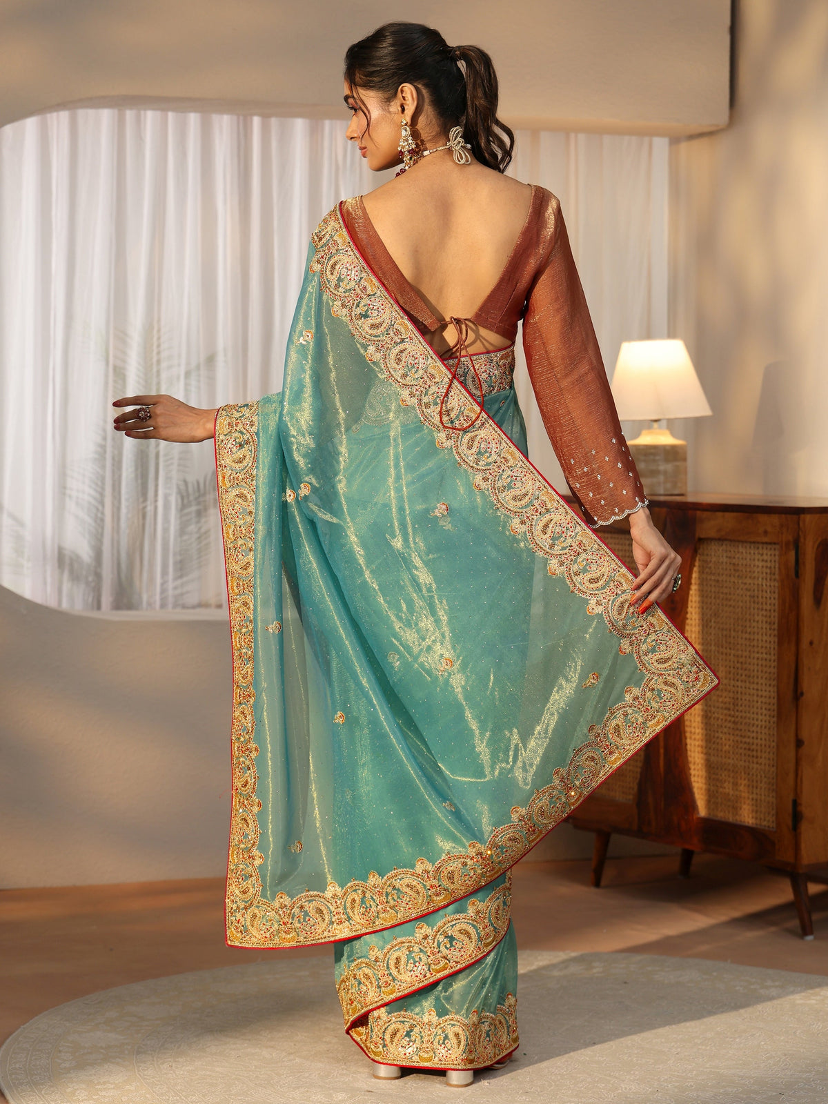 Anouk Aqua Blue Net Saree with Embellished Paisley Border