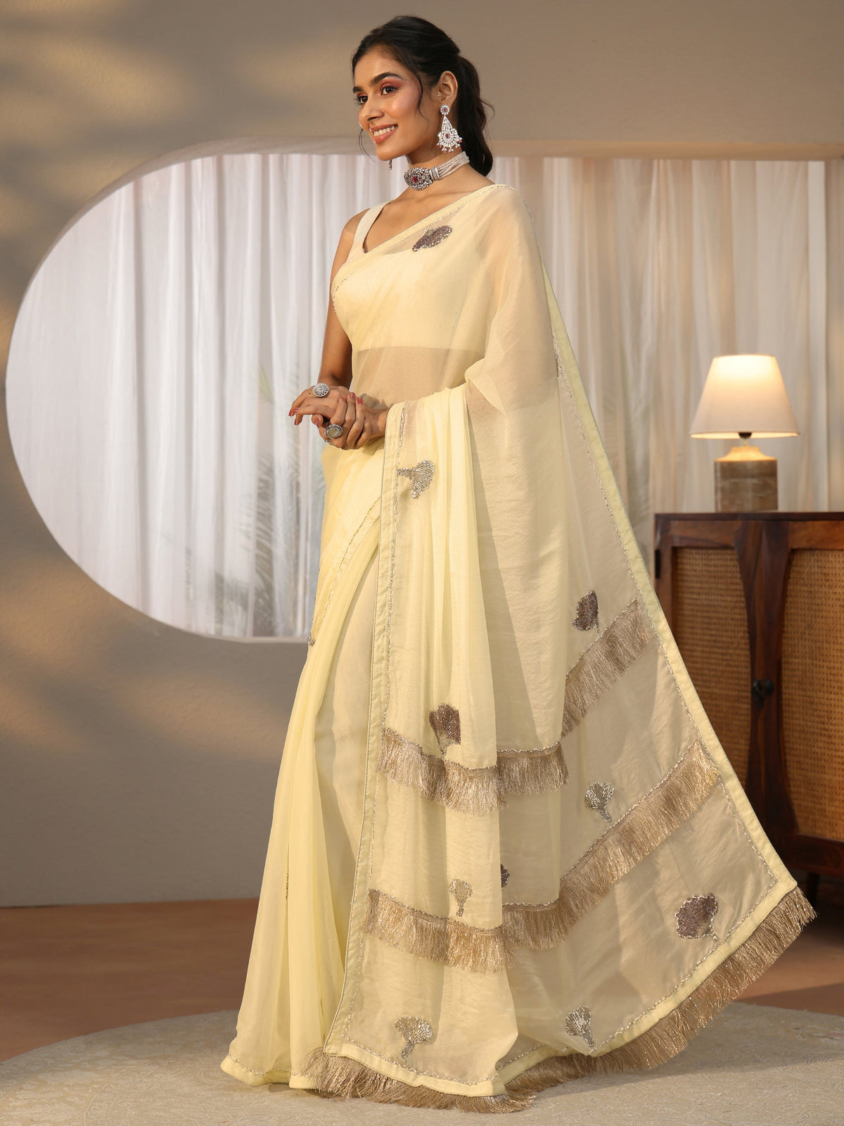 Anouk Light Yellow Tissue Saree with Tassel Embellished Pallu