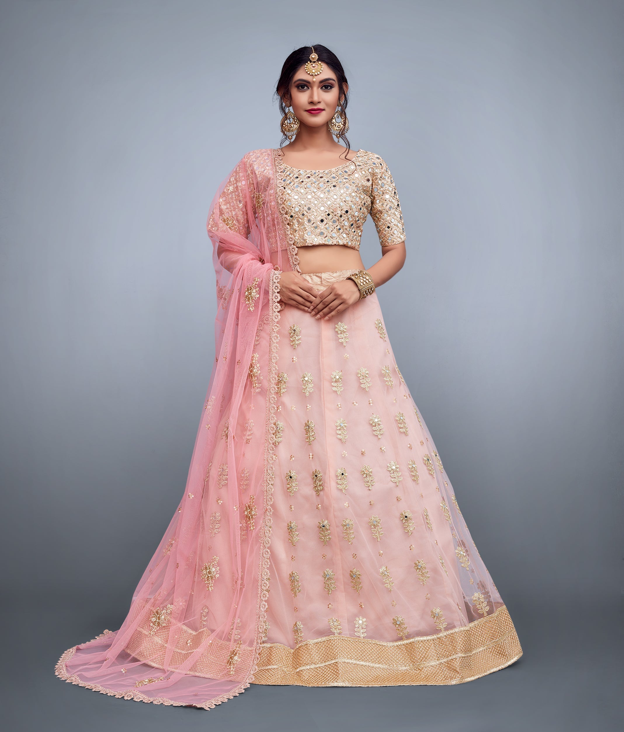 Soft Net Lehenga Choli With Embellished Mirror Work And Cut Work Dupatta