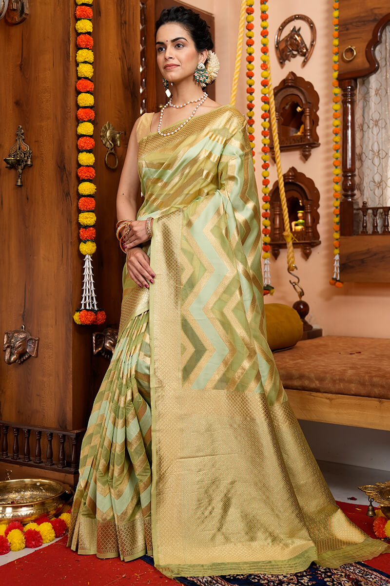A glam Mehndi Organza Silk Saree With Super Blouse Piece