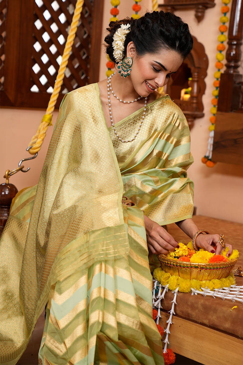 A glam Mehndi Organza Silk Saree With Super Blouse Piece