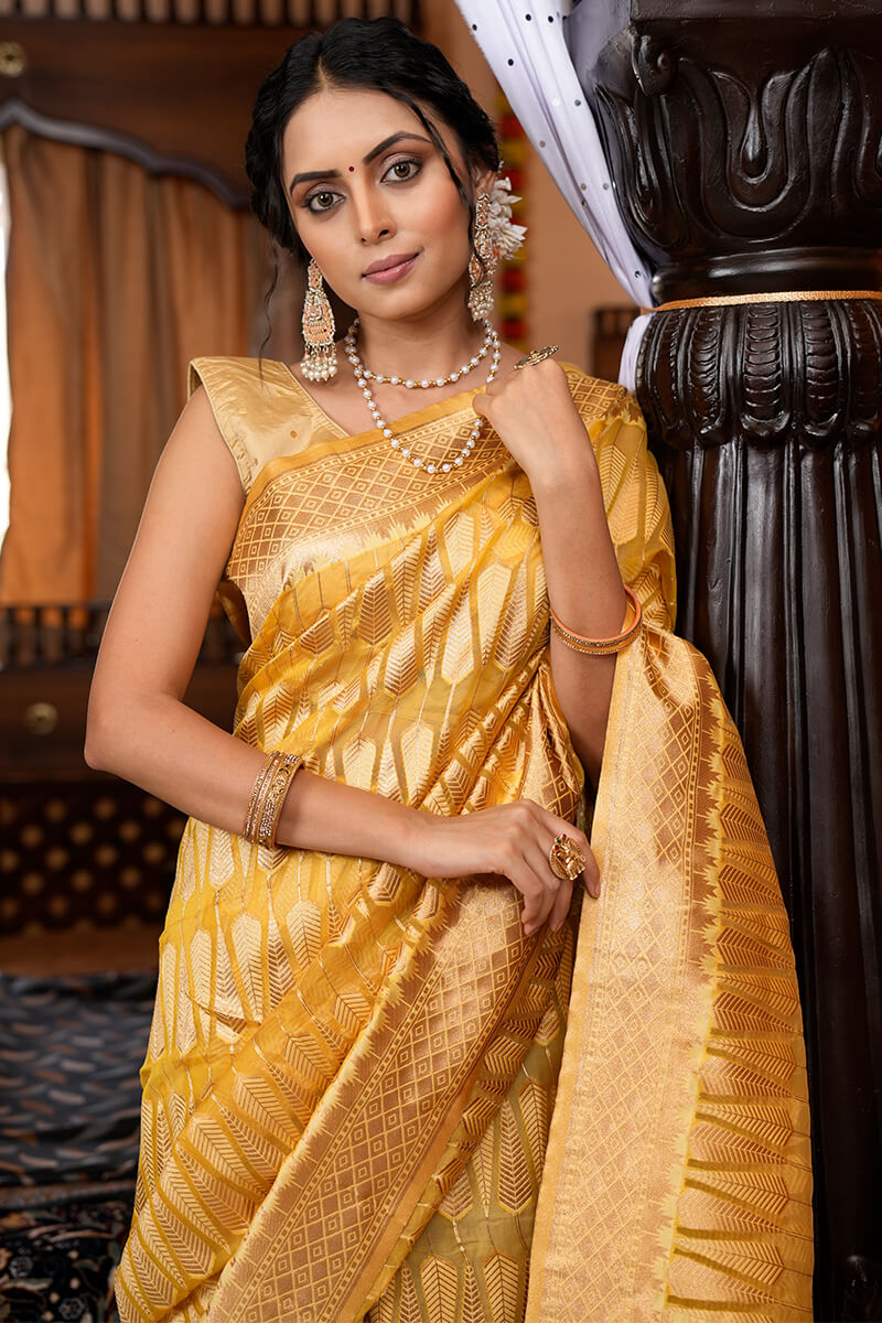 Luxuriant Yellow Organza Silk Saree With Tempting Blouse Piece