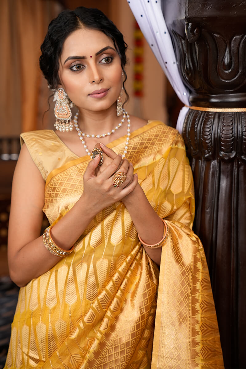 Luxuriant Yellow Organza Silk Saree With Tempting Blouse Piece