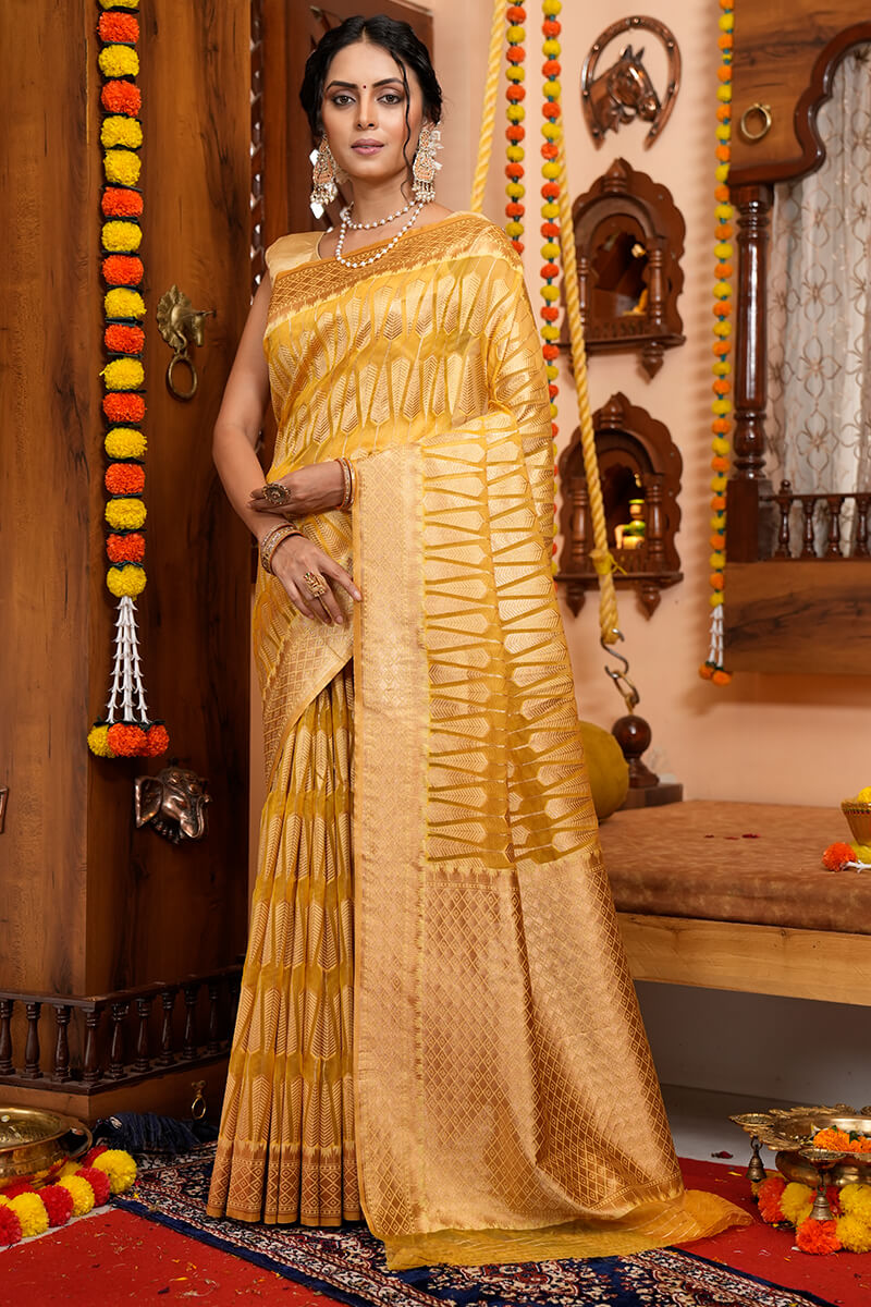 Luxuriant Yellow Organza Silk Saree With Tempting Blouse Piece