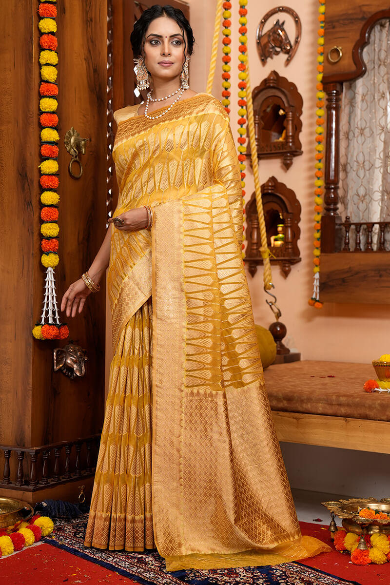 Luxuriant Yellow Organza Silk Saree With Tempting Blouse Piece
