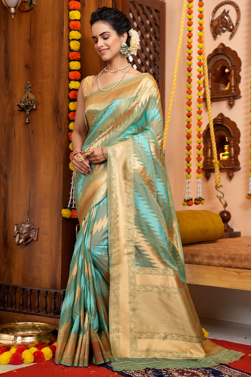 Splendorous Firozi Organza Silk Saree With Magnificat Blouse Piece