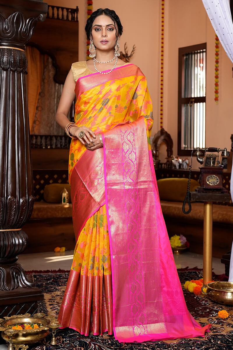 Prominent Yellow Organza Silk Saree With Snappy Blouse Piece