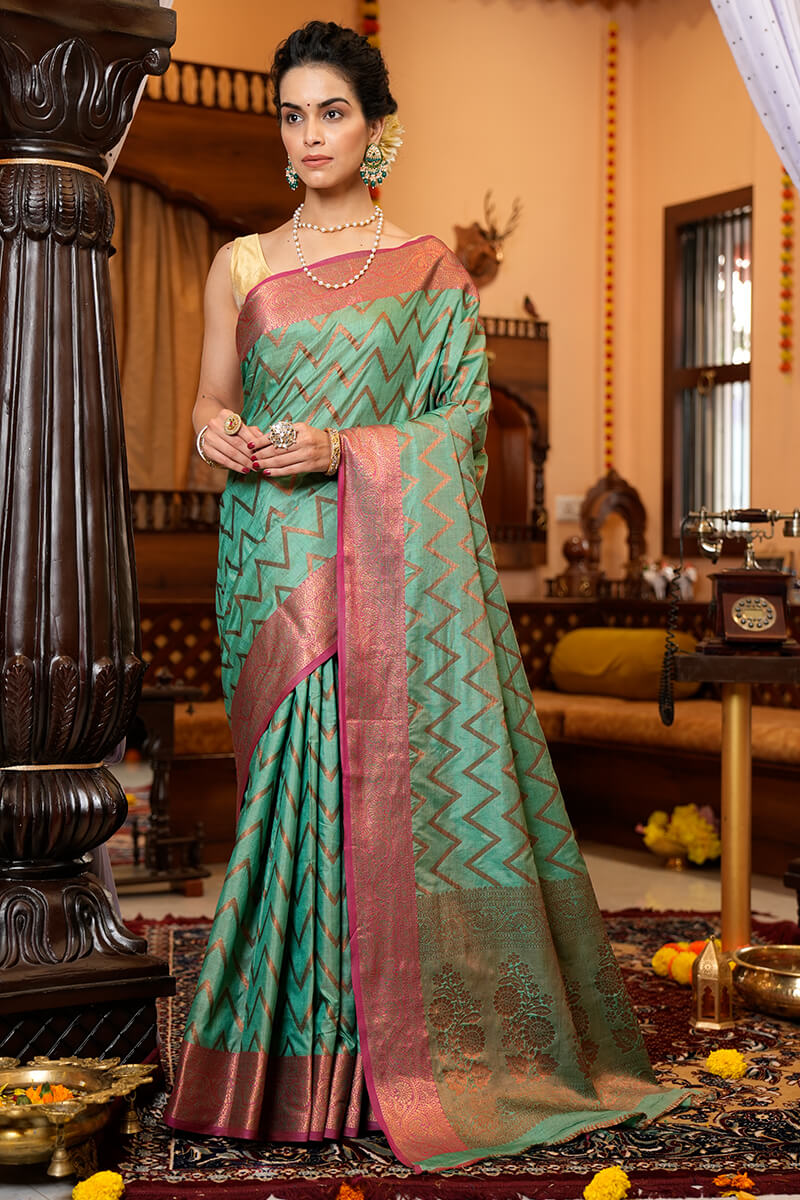 Assemblage Sea Green Soft Banarasi Silk Saree With Jazzy Blouse Piece