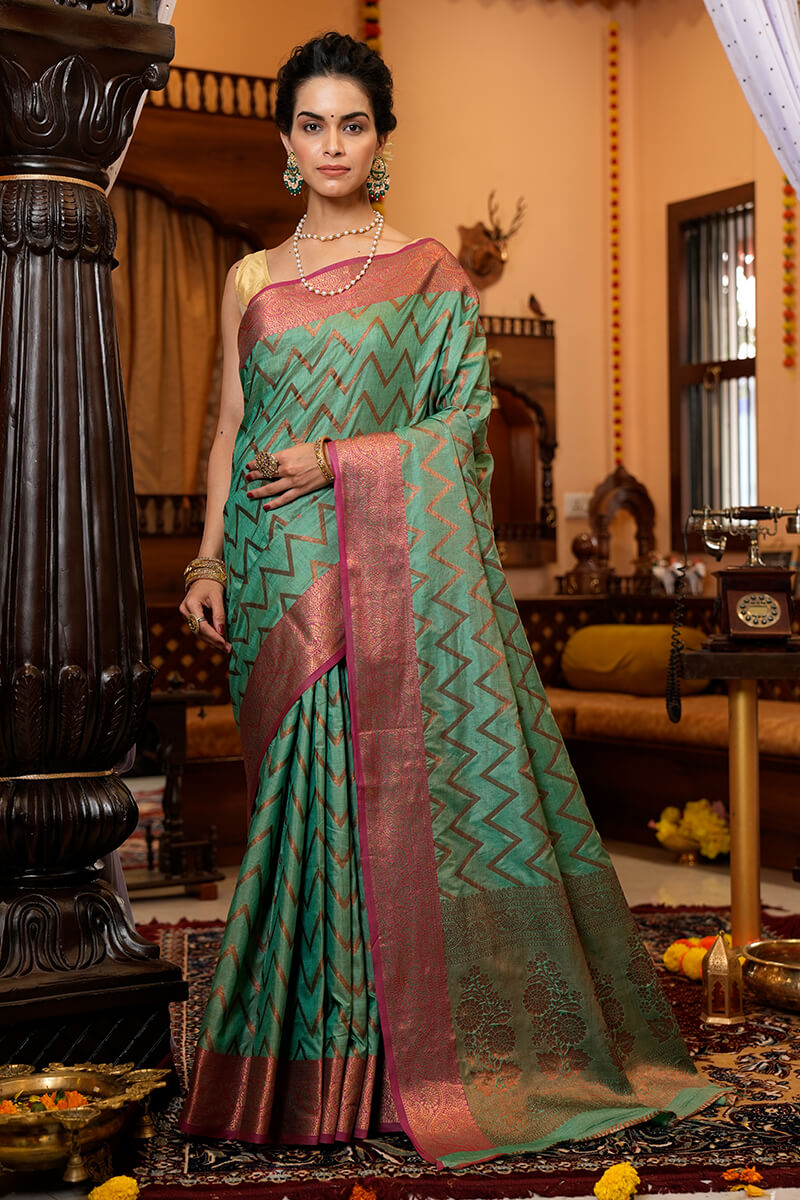 Assemblage Sea Green Soft Banarasi Silk Saree With Jazzy Blouse Piece