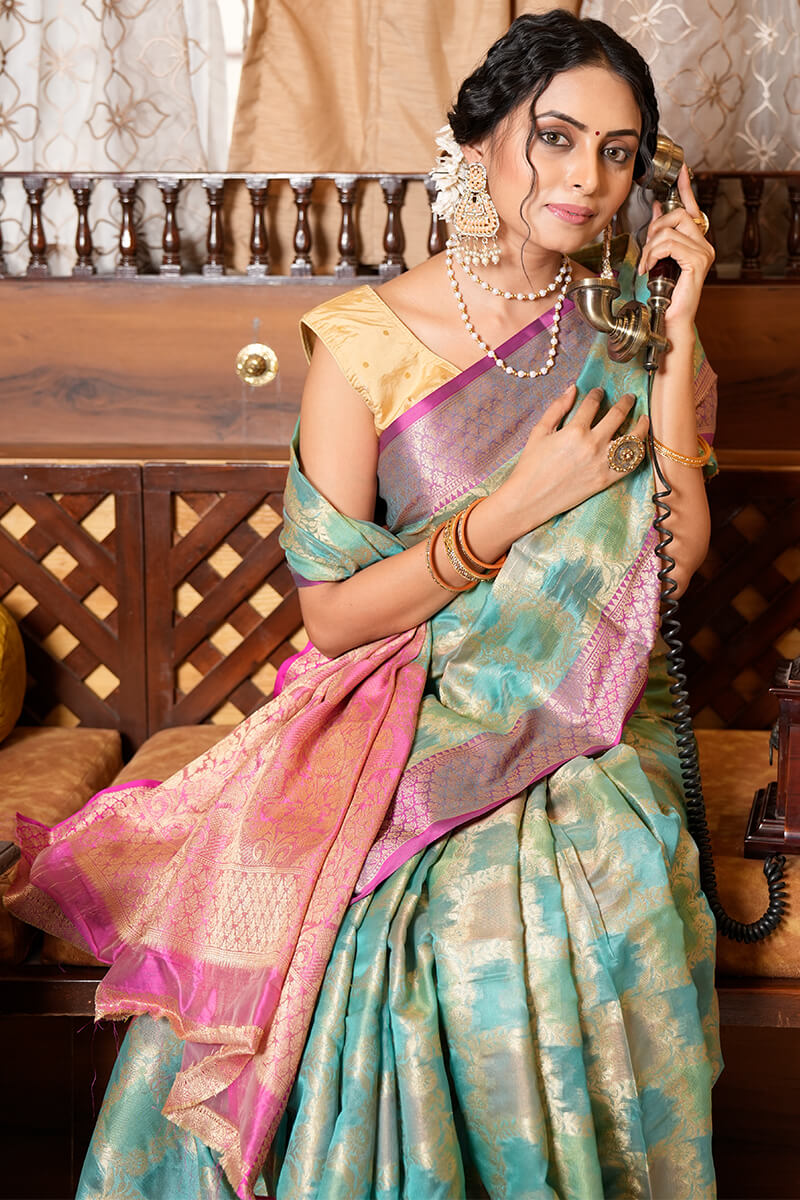 Cynosure Firozi Organza Silk Saree With Demesne Blouse Piece