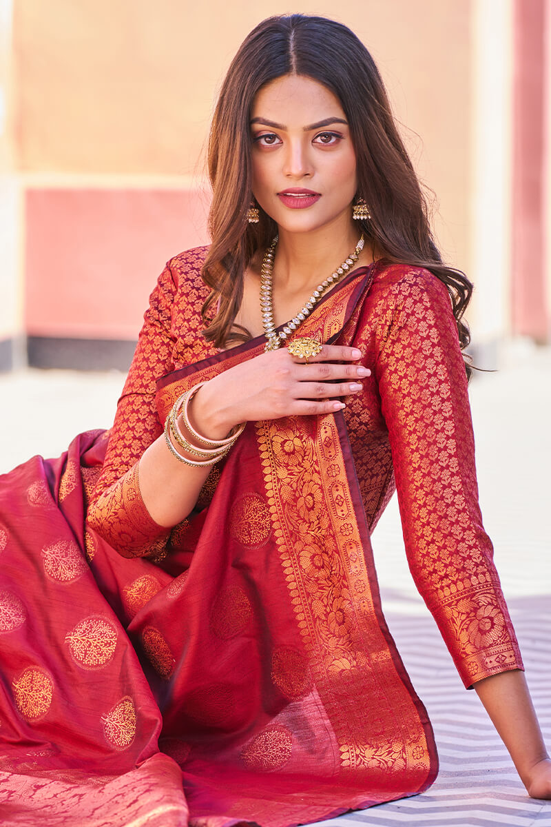 Adorable Maroon Banarasi Silk Saree With Hypnotic Blouse Piece