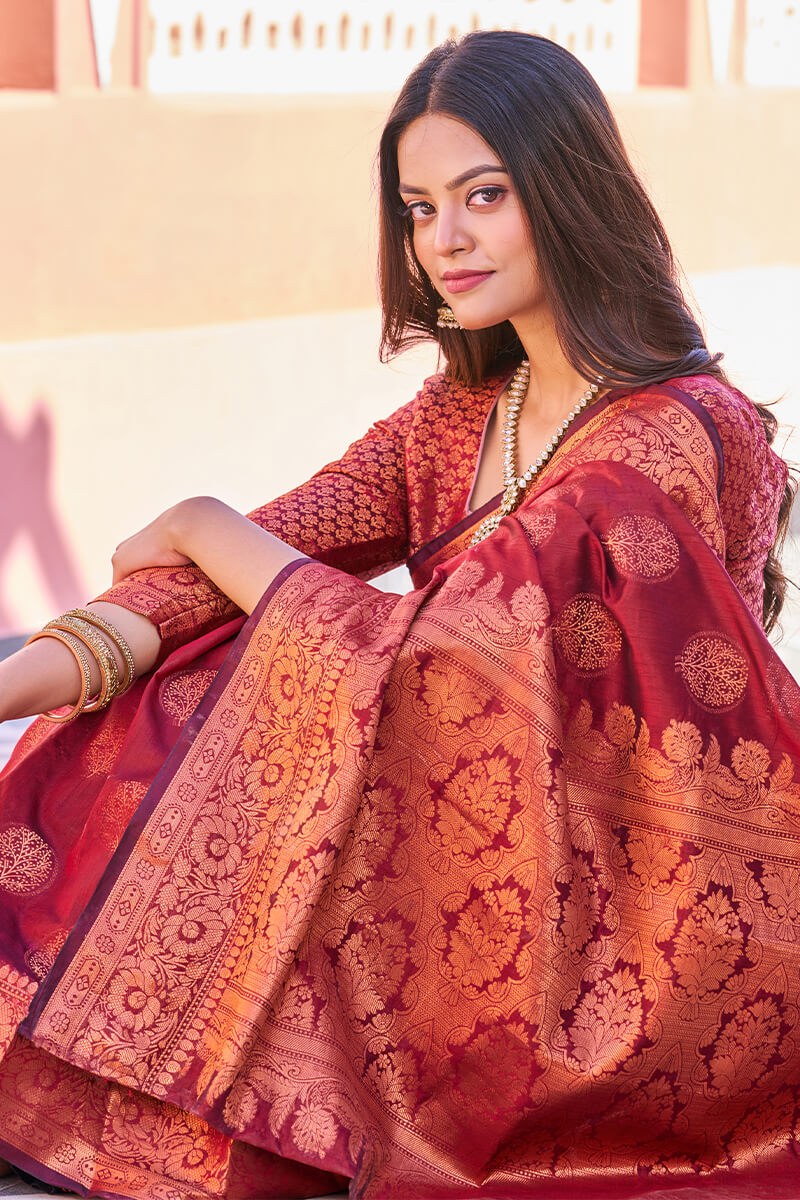 Adorable Maroon Banarasi Silk Saree With Hypnotic Blouse Piece
