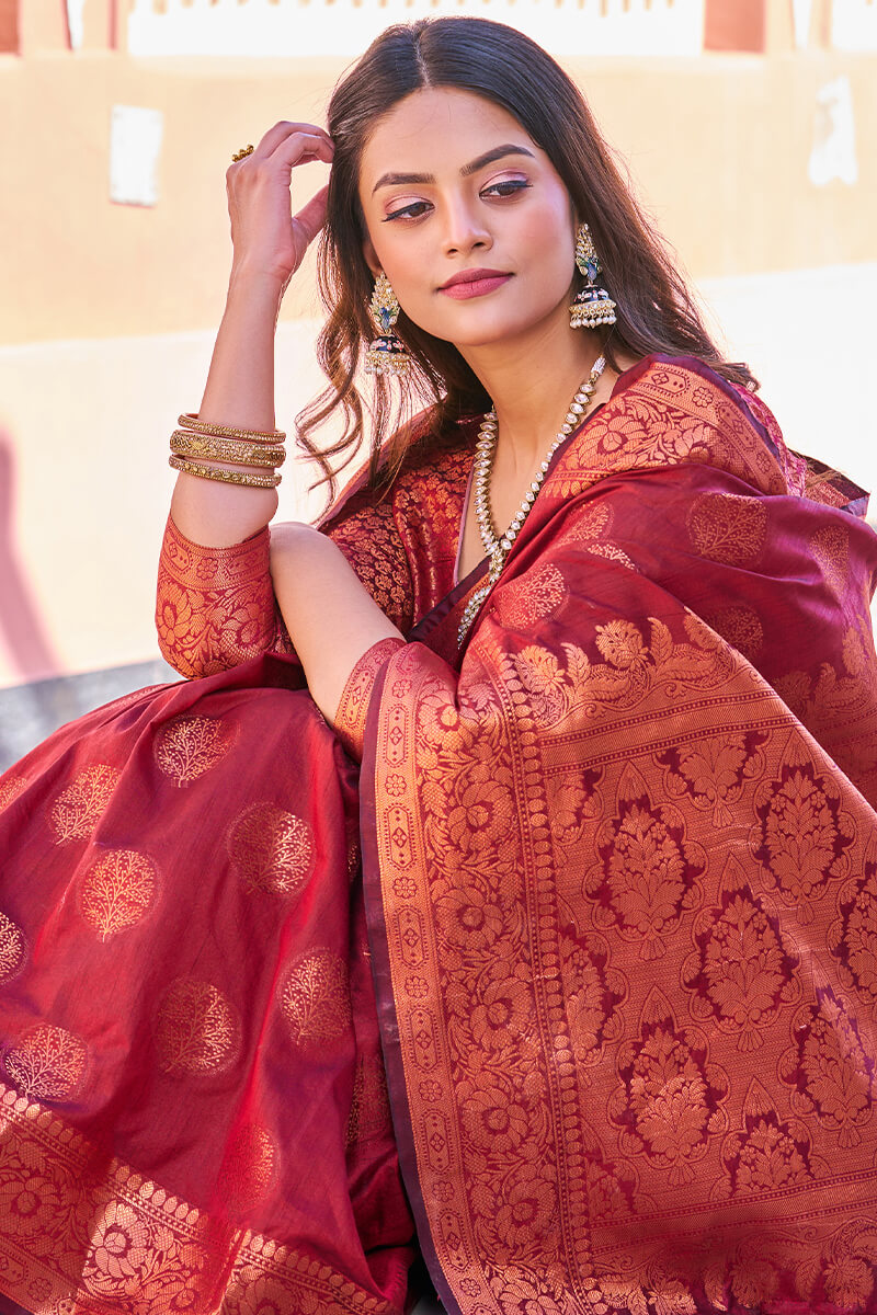 Adorable Maroon Banarasi Silk Saree With Hypnotic Blouse Piece
