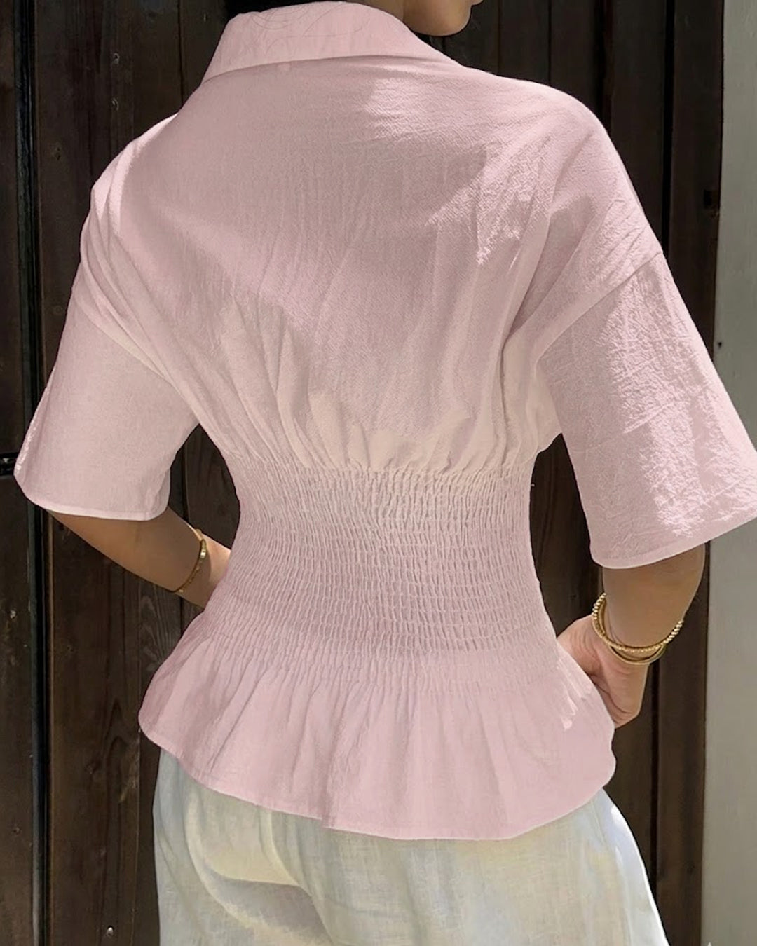 Collared Neck Smocked Waist Flared Hem Top in Baby Pink