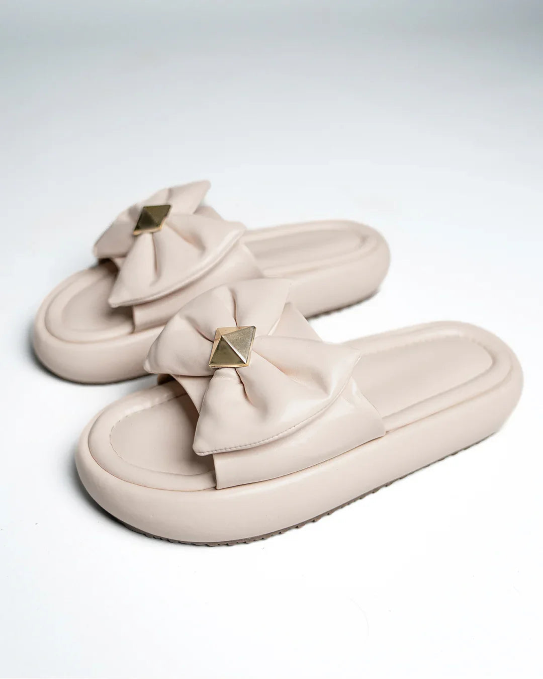 Quilted Slide Sandals With Bow And Gold Charm Detail