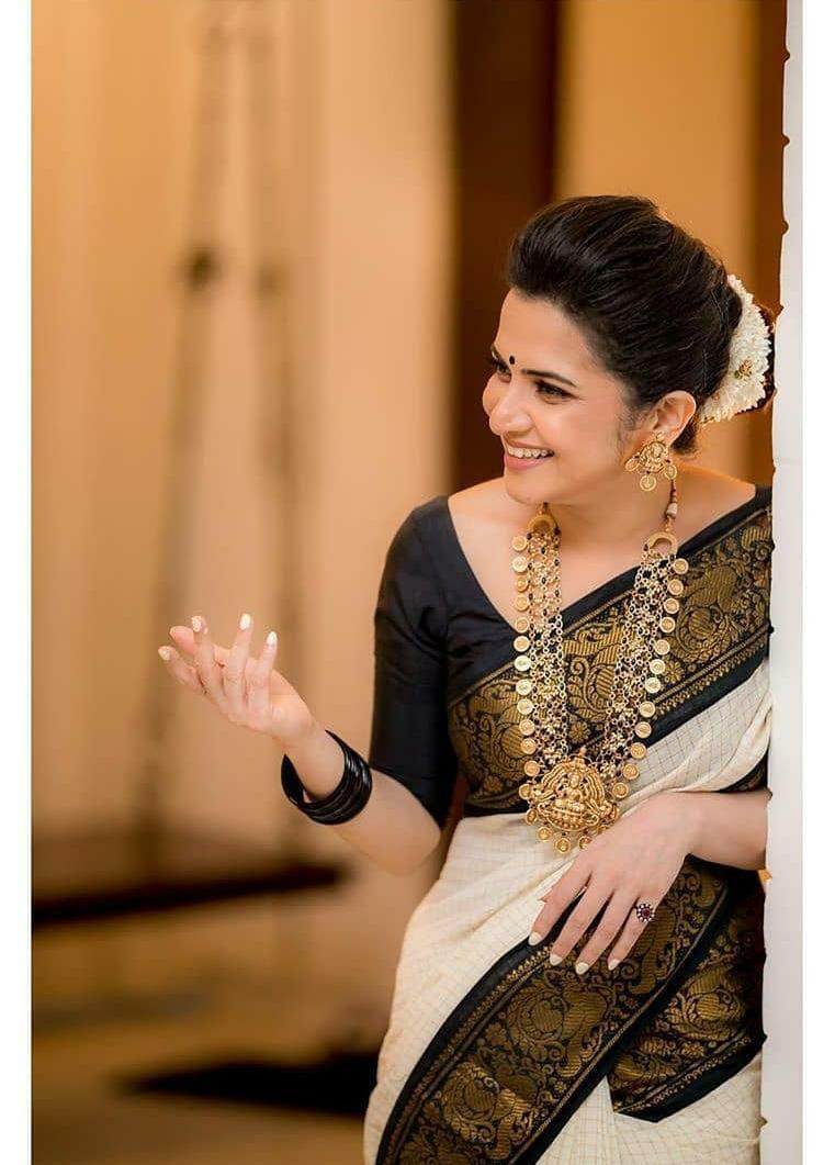 Twirling Off White Soft Banarasi Silk Saree With Panoply Blouse Piece