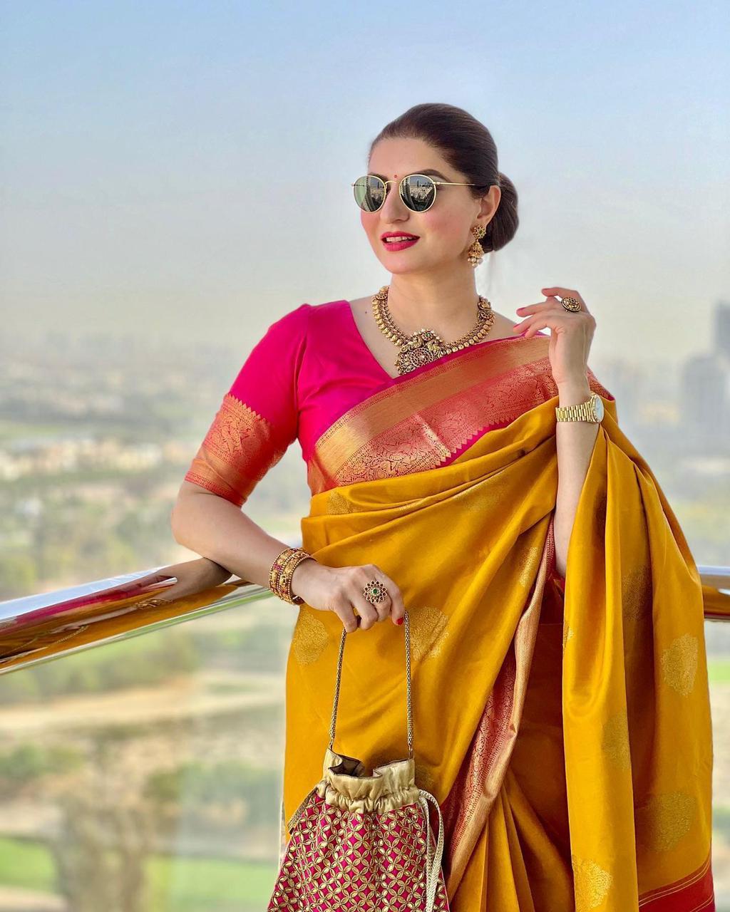 Dissemble Yellow Soft Banarasi Silk Saree With Blissful Blouse Piece