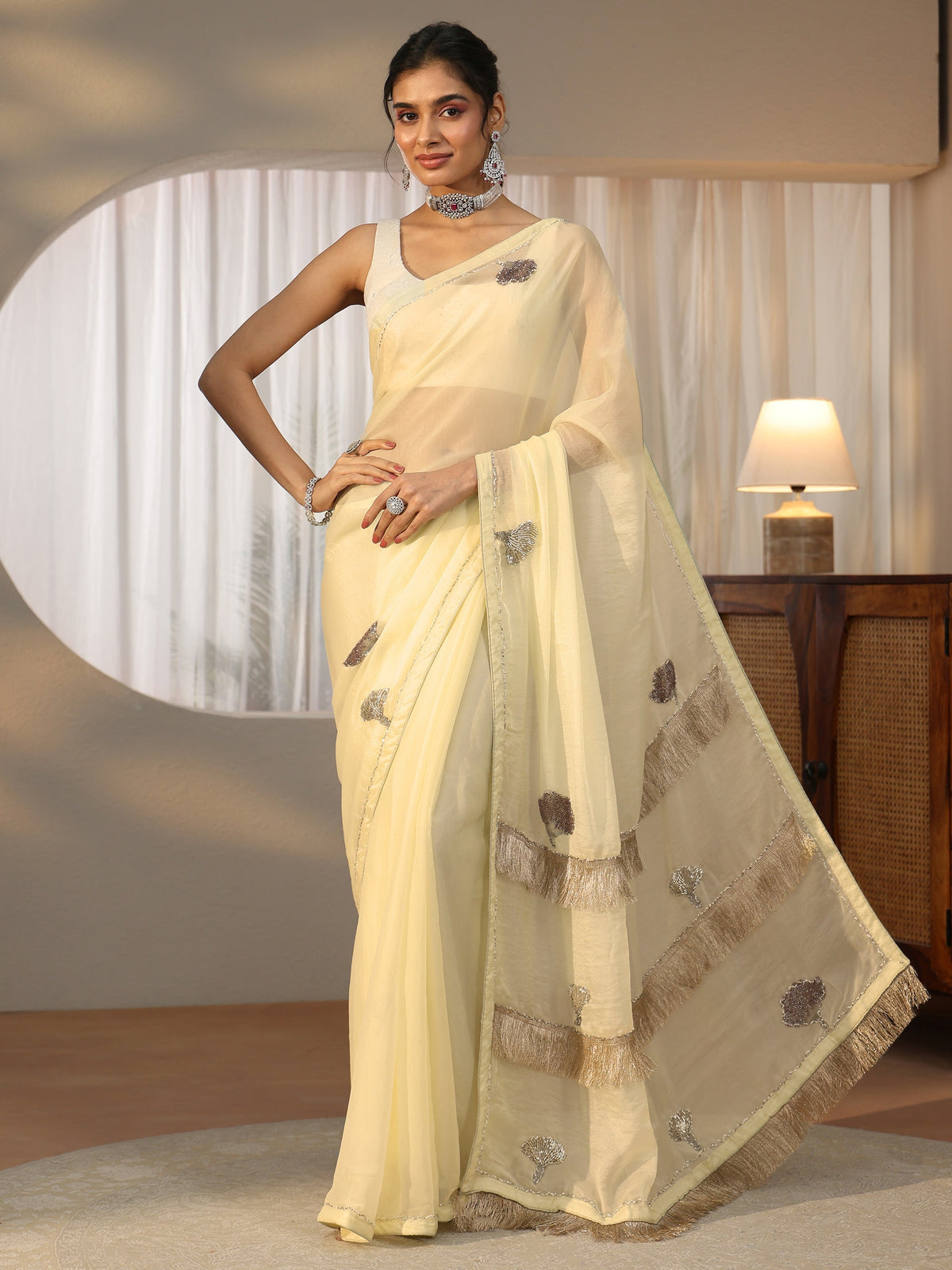 Anouk Light Yellow Tissue Saree with Tassel Embellished Pallu