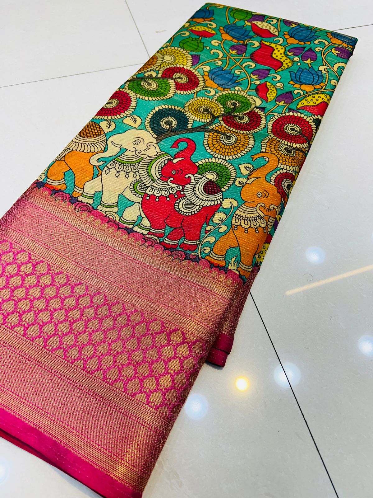 Mesmerising Firozi Kalamkari Printed Saree With Ailurophile Blouse Piece