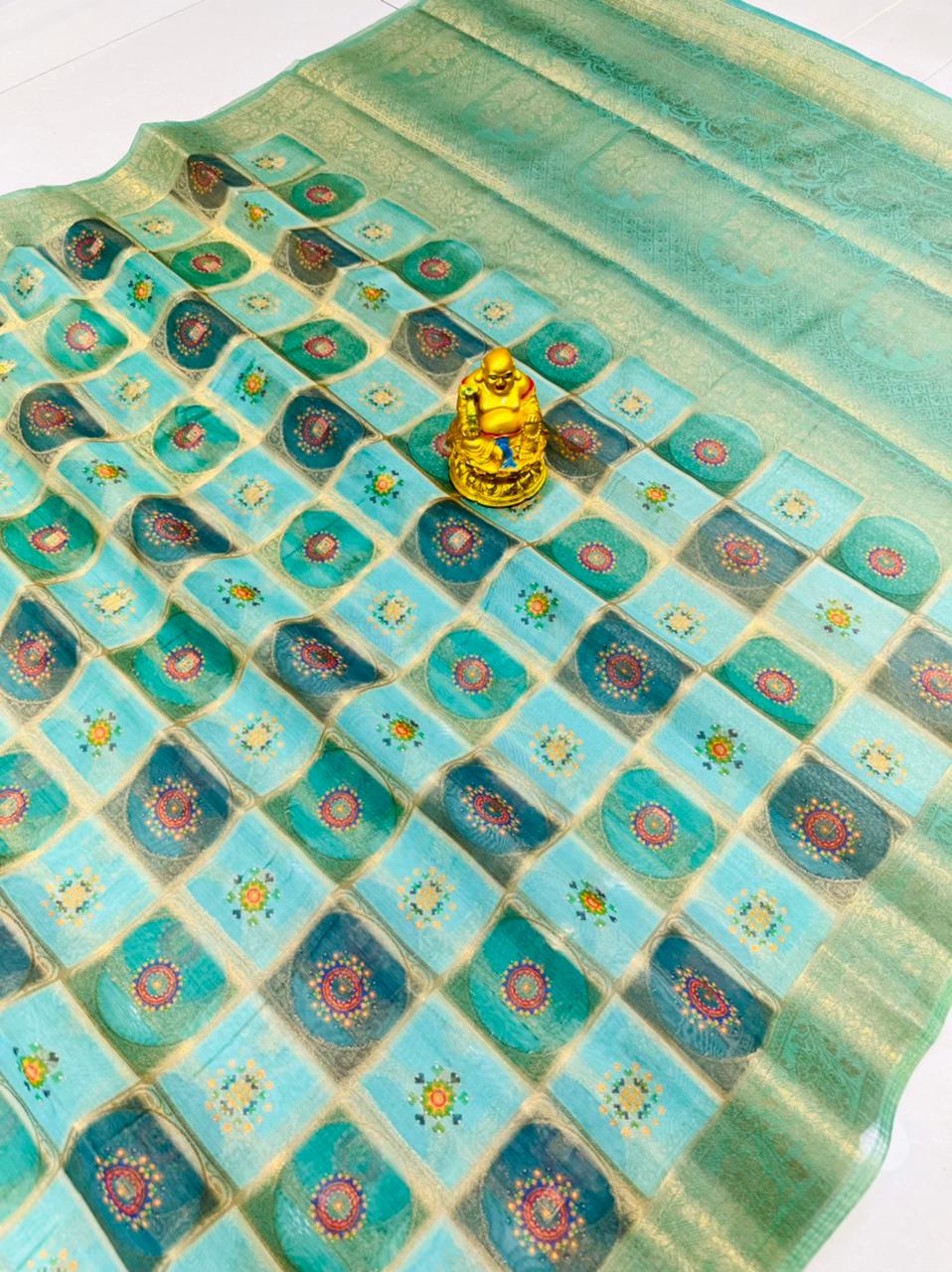 Engrossing Turquoise Soft Patola Silk Saree with Blissful Blouse Piece