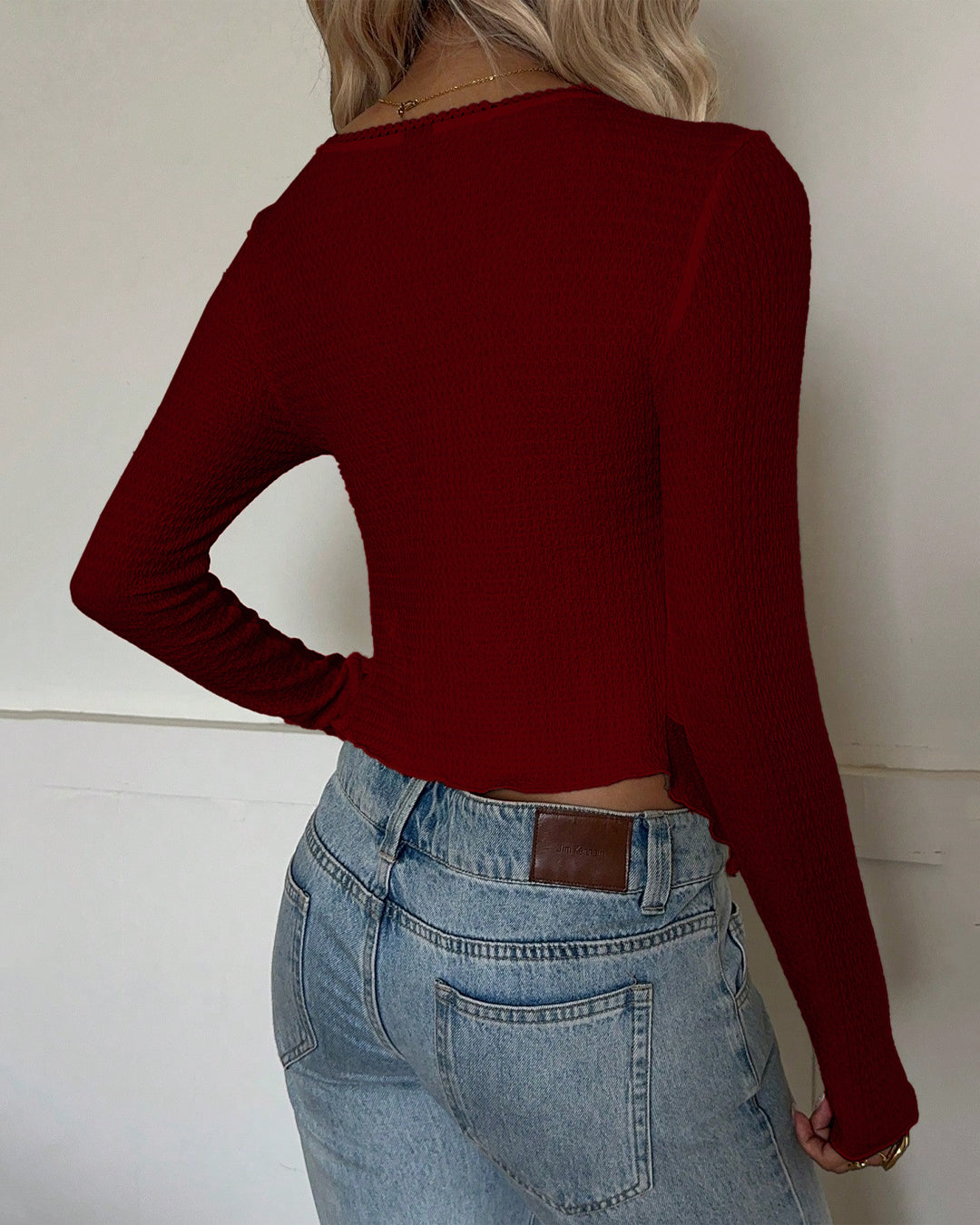 Solid Color Asymmetrical Hem Long Sleeve Top in Crimson Red