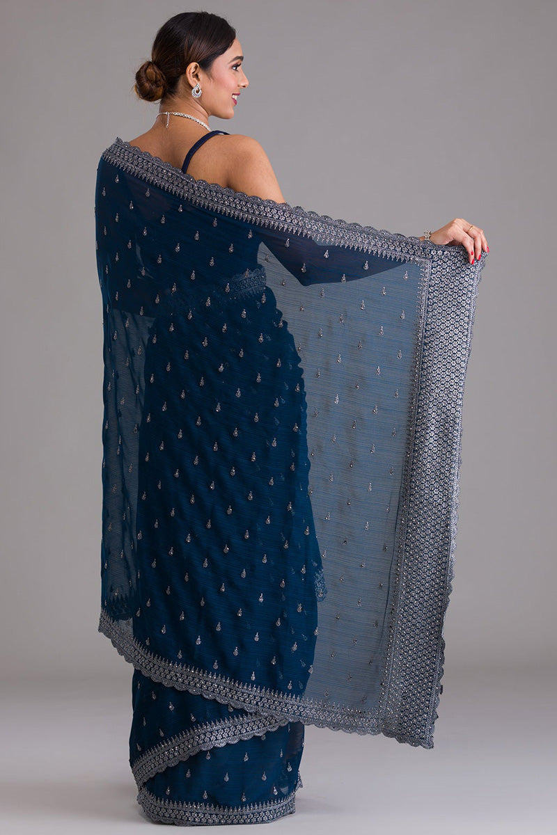 Chinon Fabric Tempting Sequins Work Saree In Navy Blue Color