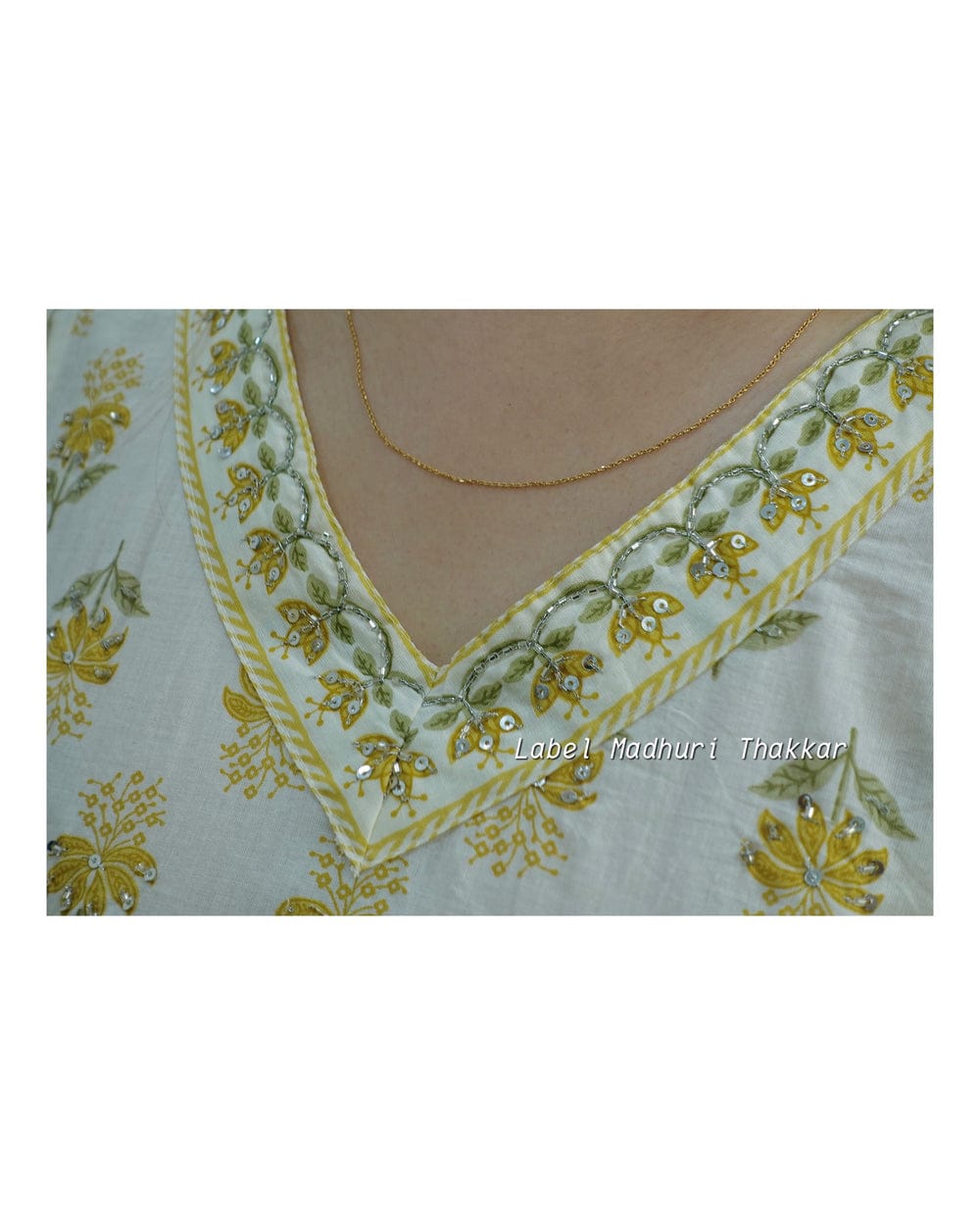 White Floral Afghani Suit Set with Side Waist Tassels and Motifs
