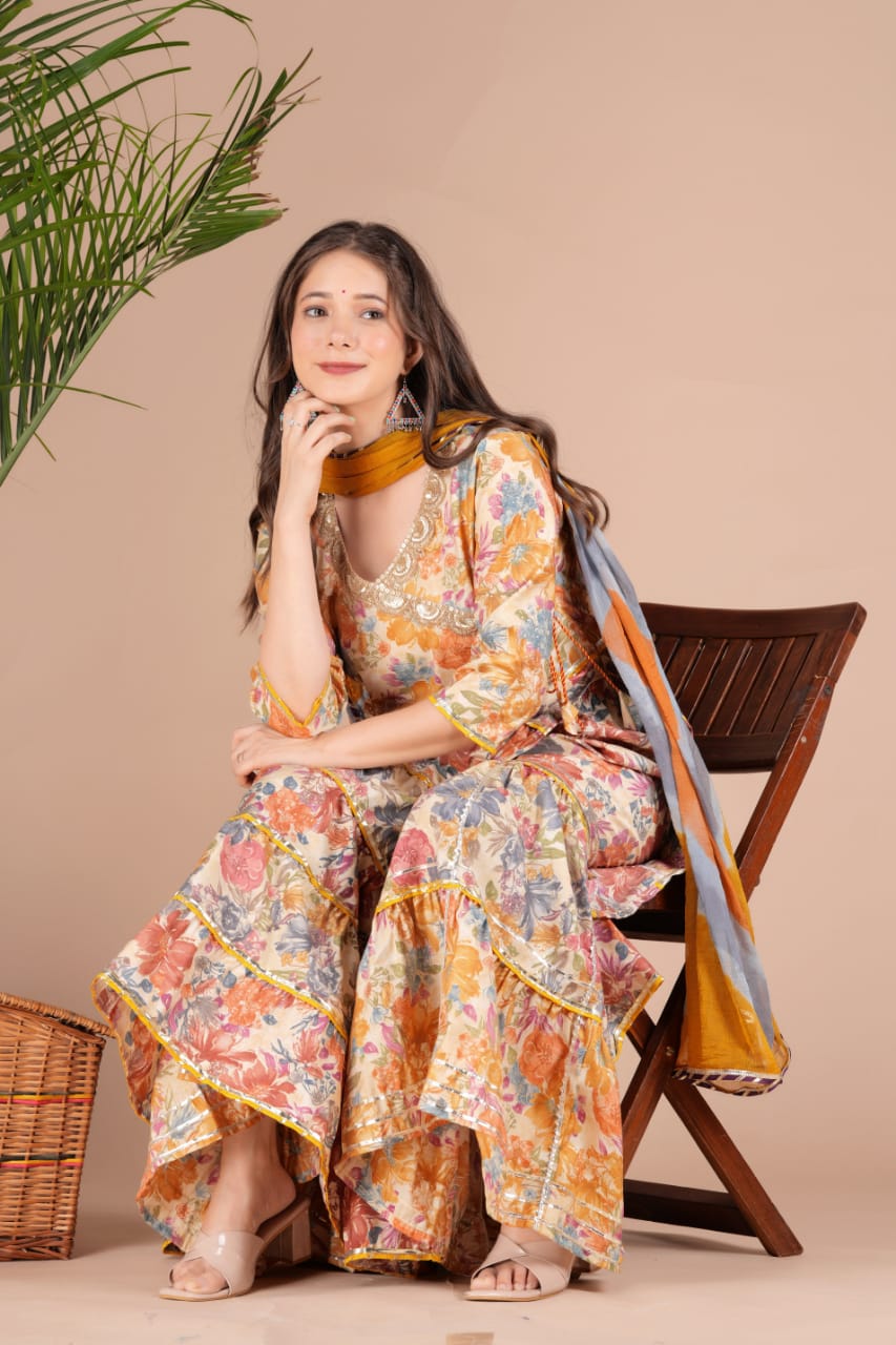 Golden Sequence Muslin Sharara Set with Sidelong Slit Kurti and Chiffon Tie-n-Dye Dupatta