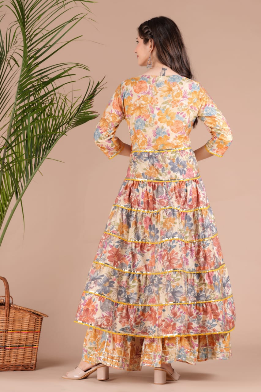 Golden Sequence Muslin Sharara Set with Sidelong Slit Kurti and Chiffon Tie-n-Dye Dupatta