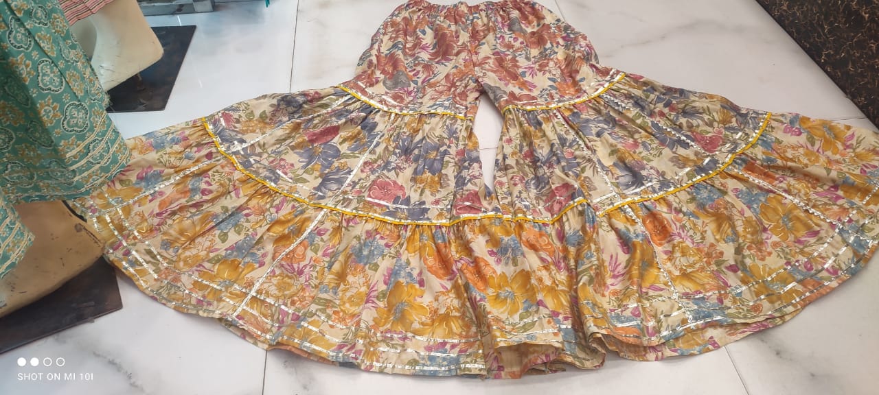 Golden Sequence Muslin Sharara Set with Sidelong Slit Kurti and Chiffon Tie-n-Dye Dupatta
