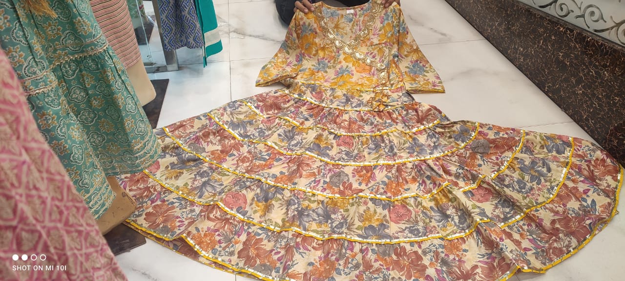 Golden Sequence Muslin Sharara Set with Sidelong Slit Kurti and Chiffon Tie-n-Dye Dupatta