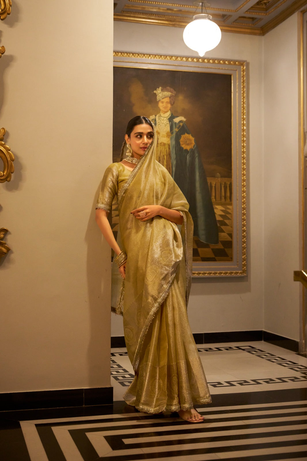 Gold Elegant Tissue Shimmer Saree with Zari Weaving and Sequins Lace Border