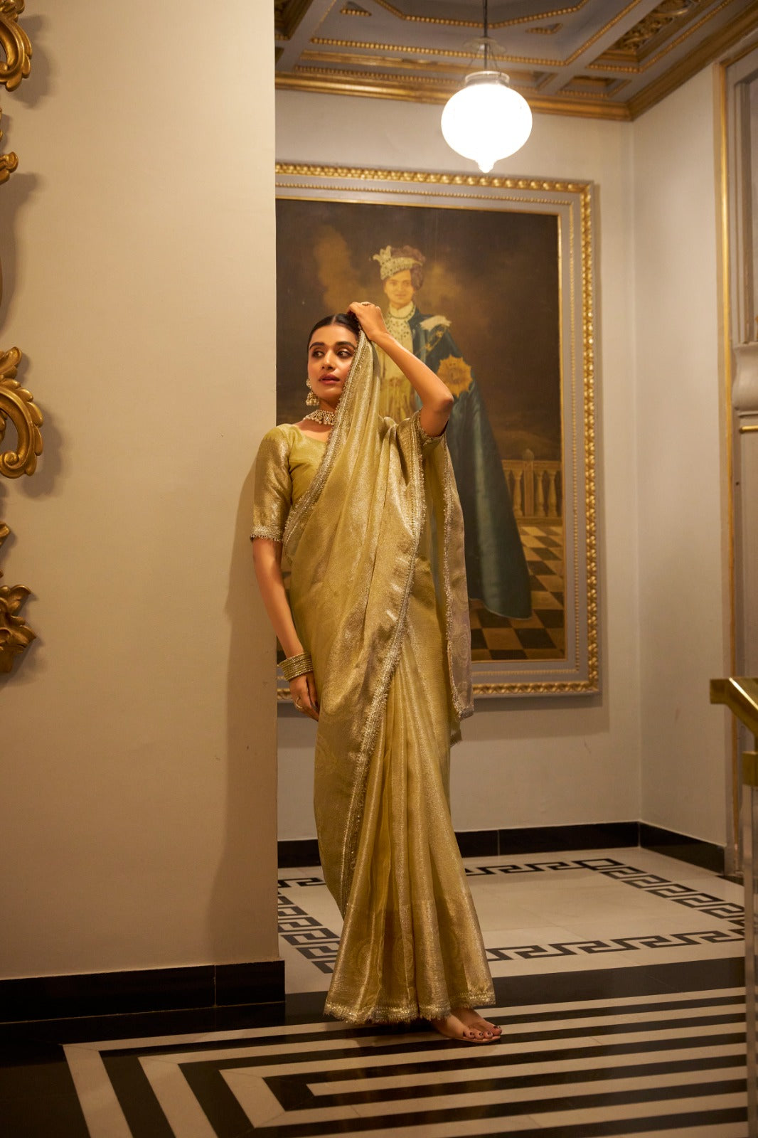 Gold Elegant Tissue Shimmer Saree with Zari Weaving and Sequins Lace Border