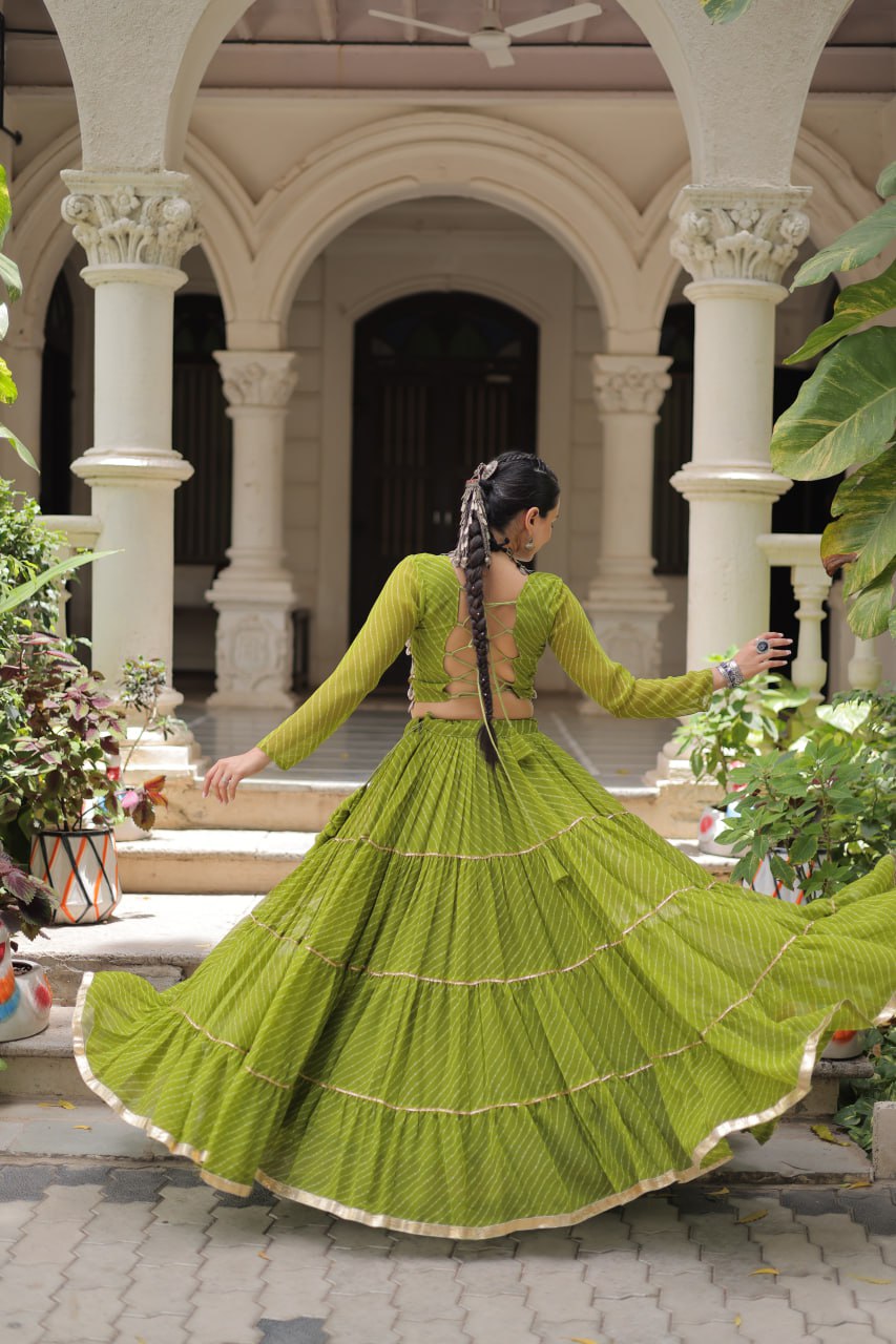 Parrot Green Navratri Special Leheriya Print Lehenga Choli with 12 Mtr Flair & Mirror Lace Work