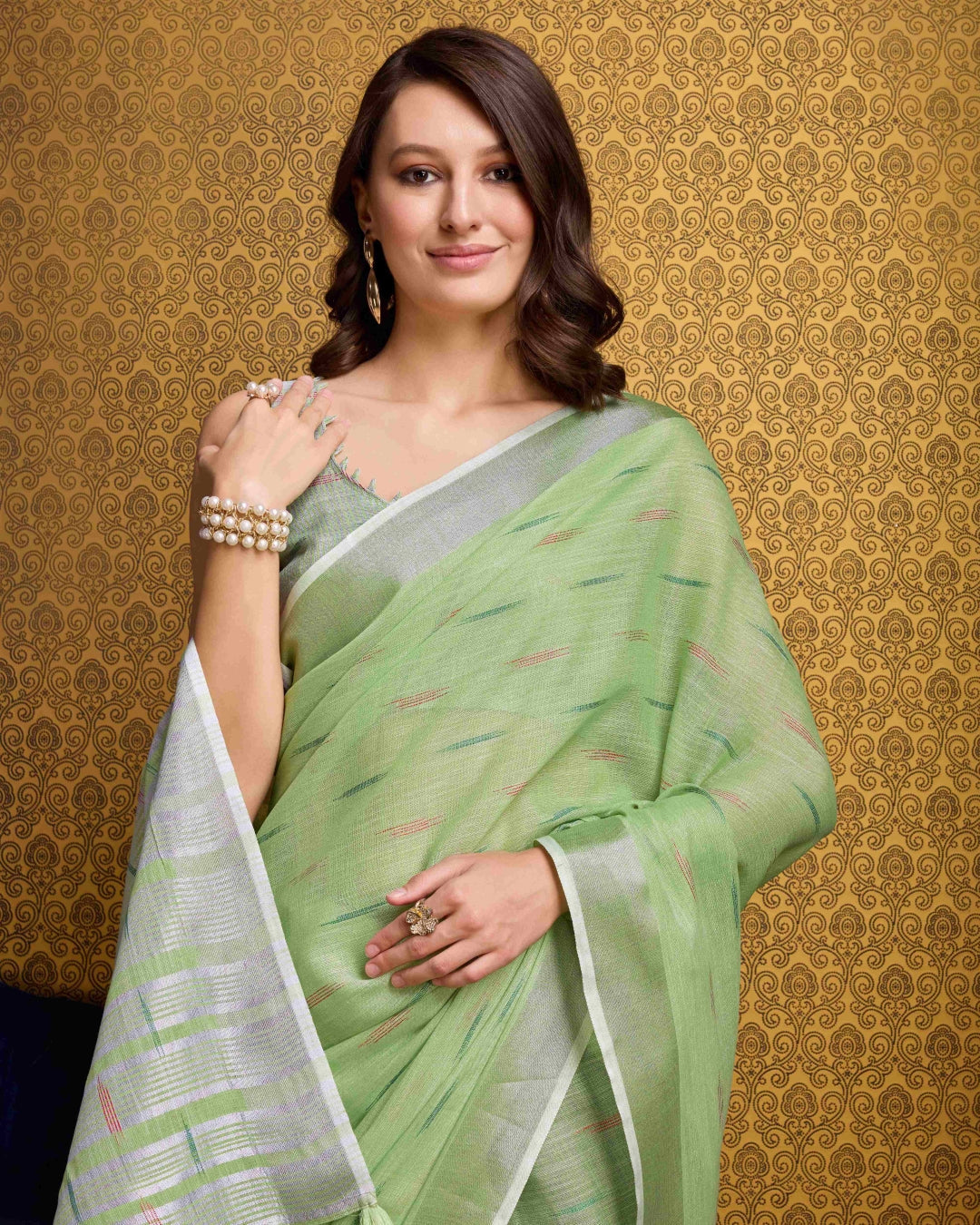 Pista Elegant & Gold-Toned Ikat Woven Saree with Zari Border