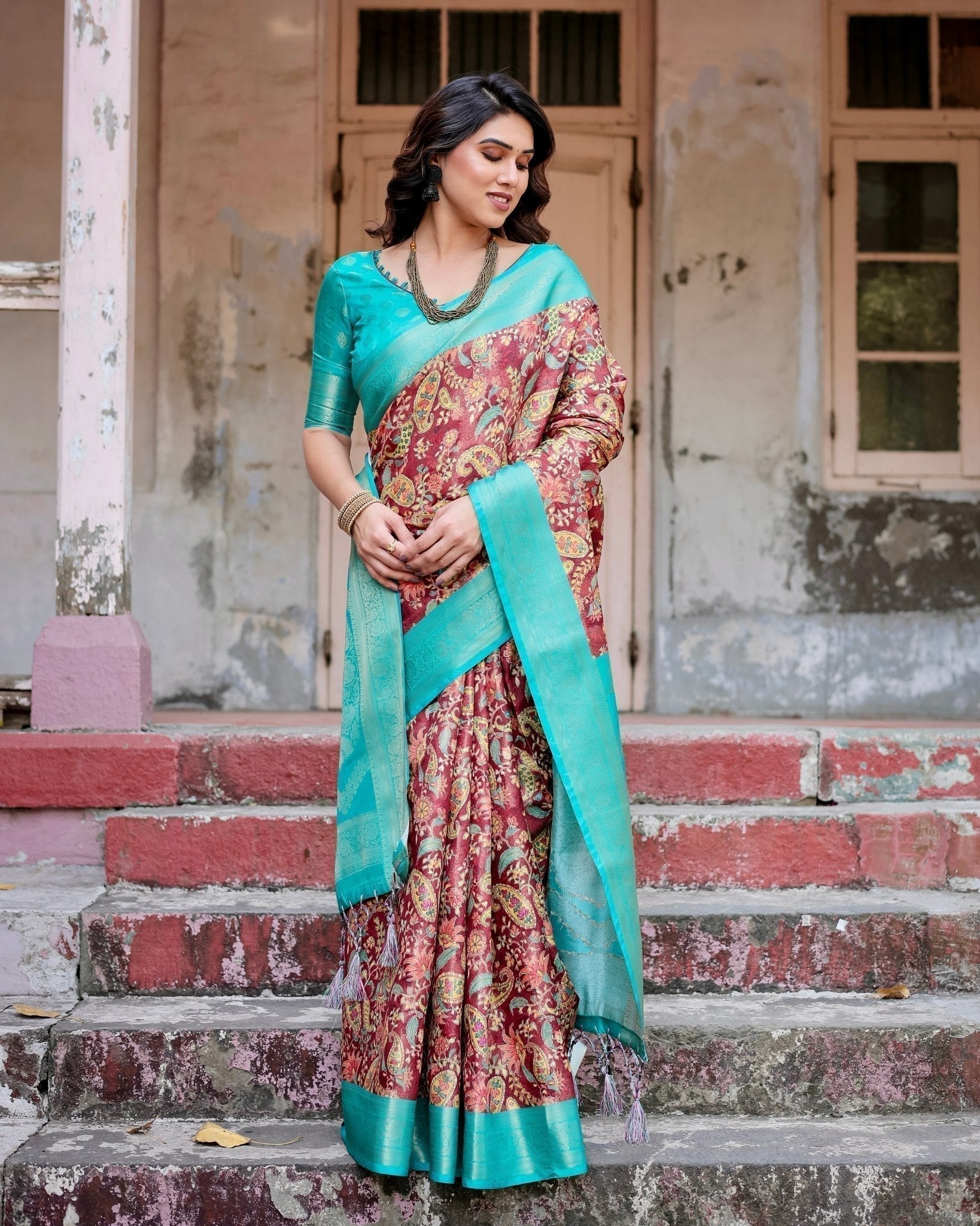 Maroon and Teal Paisley Design Banarasi Silk Saree with Zari Weave and Tassel-Embellished Pallu