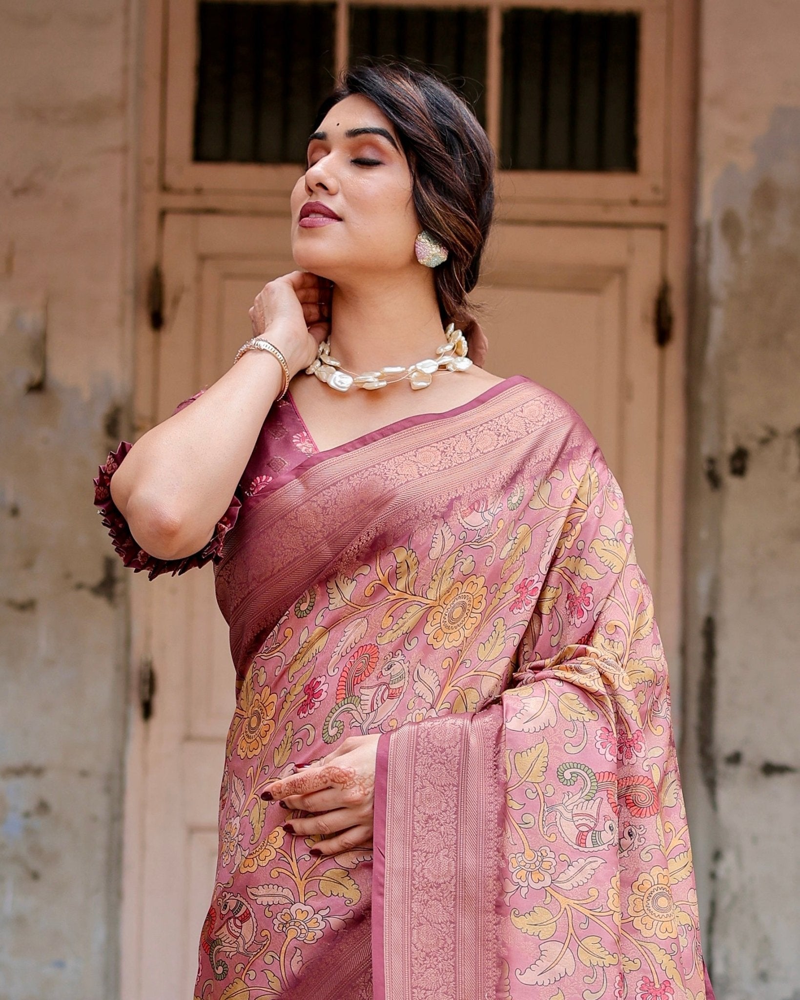 Elegant Pink Banarasi Silk Saree with Floral Zari Weaving and Tassel-Embellished Pallu