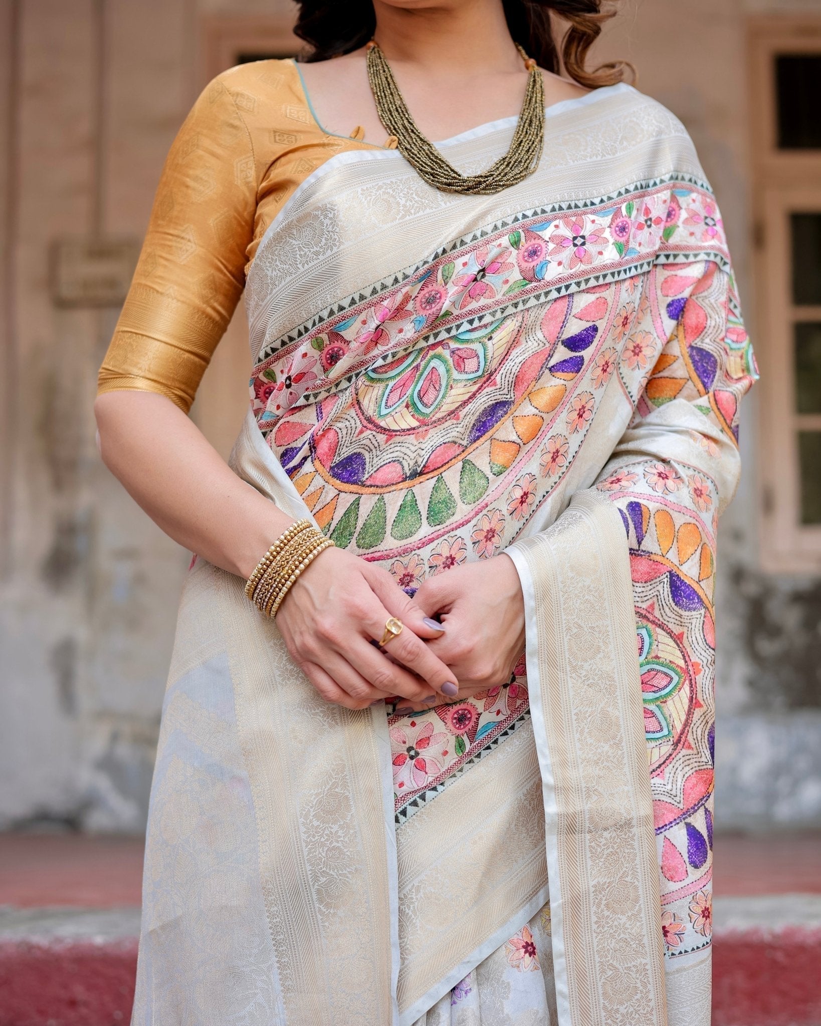 Off-White and Multicolor Mandala Design Banarasi Silk Saree with Zari Weave and Tassel-Adorned Pallu