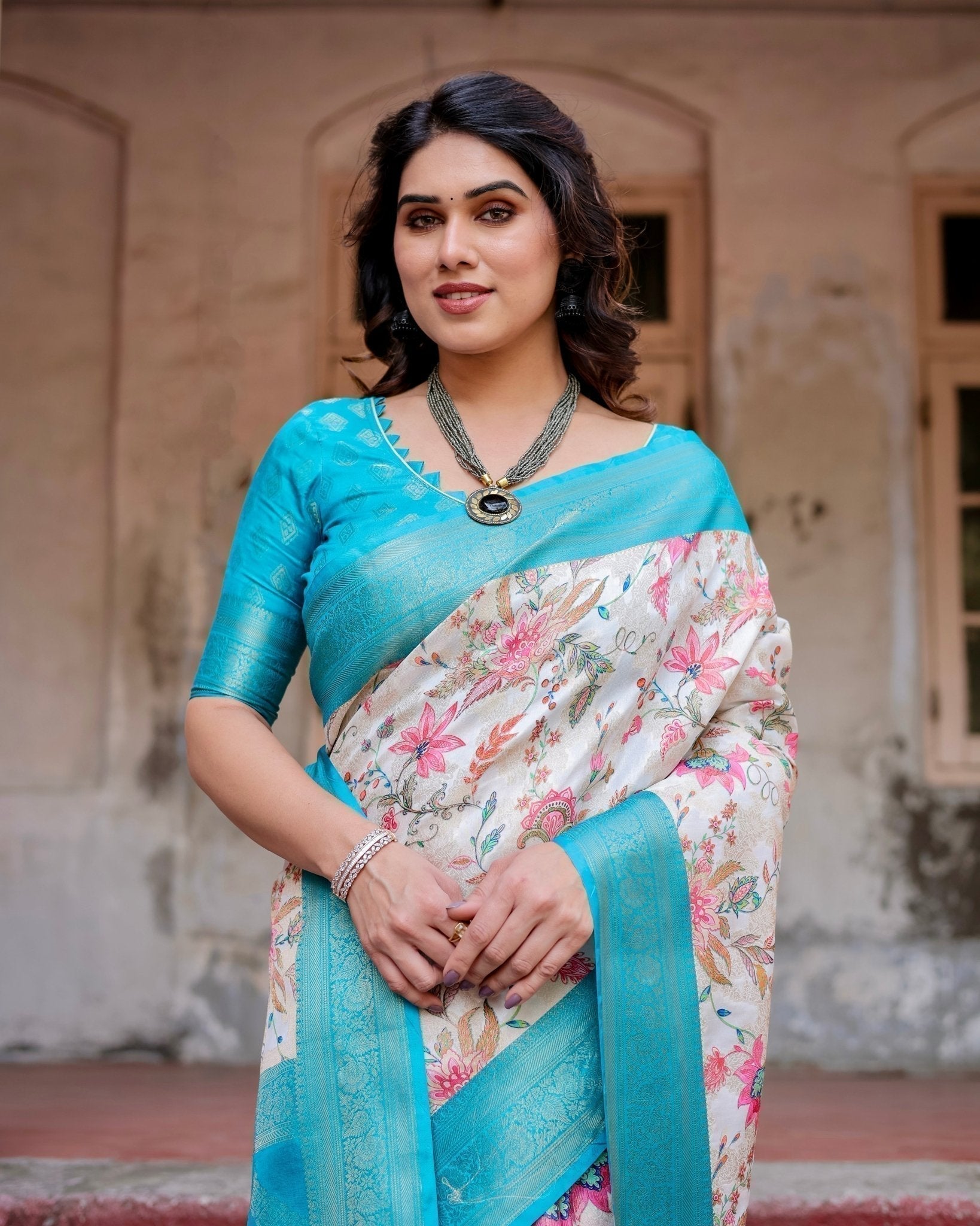 White and Aqua Floral Design Banarasi Silk Saree with Zari Weave and Tassel-Embellished Pallu