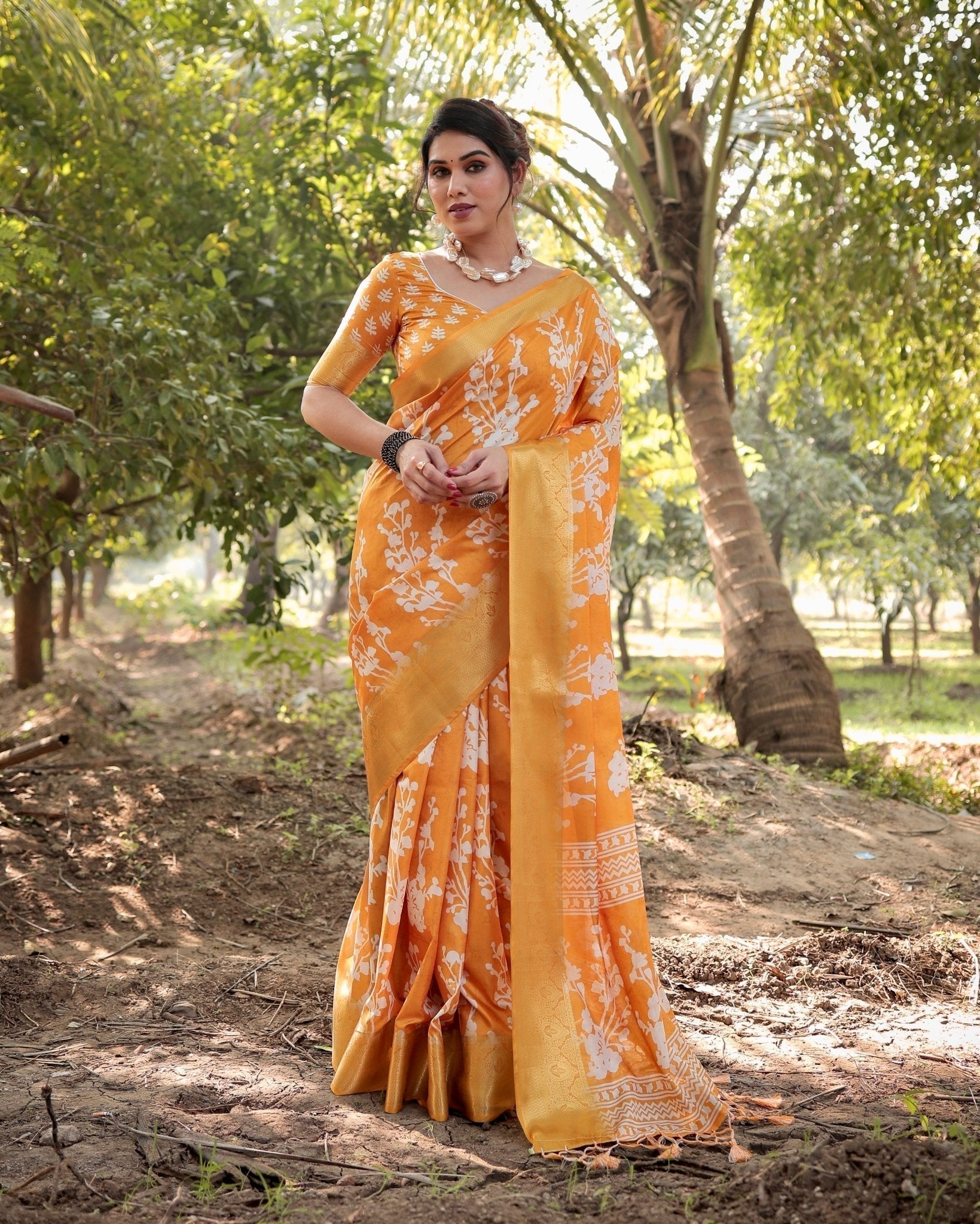 Sunshine Yellow Tussar Silk Saree with White Floral Motifs, Lustrous Zari Border, and Graceful Tassel Pallu