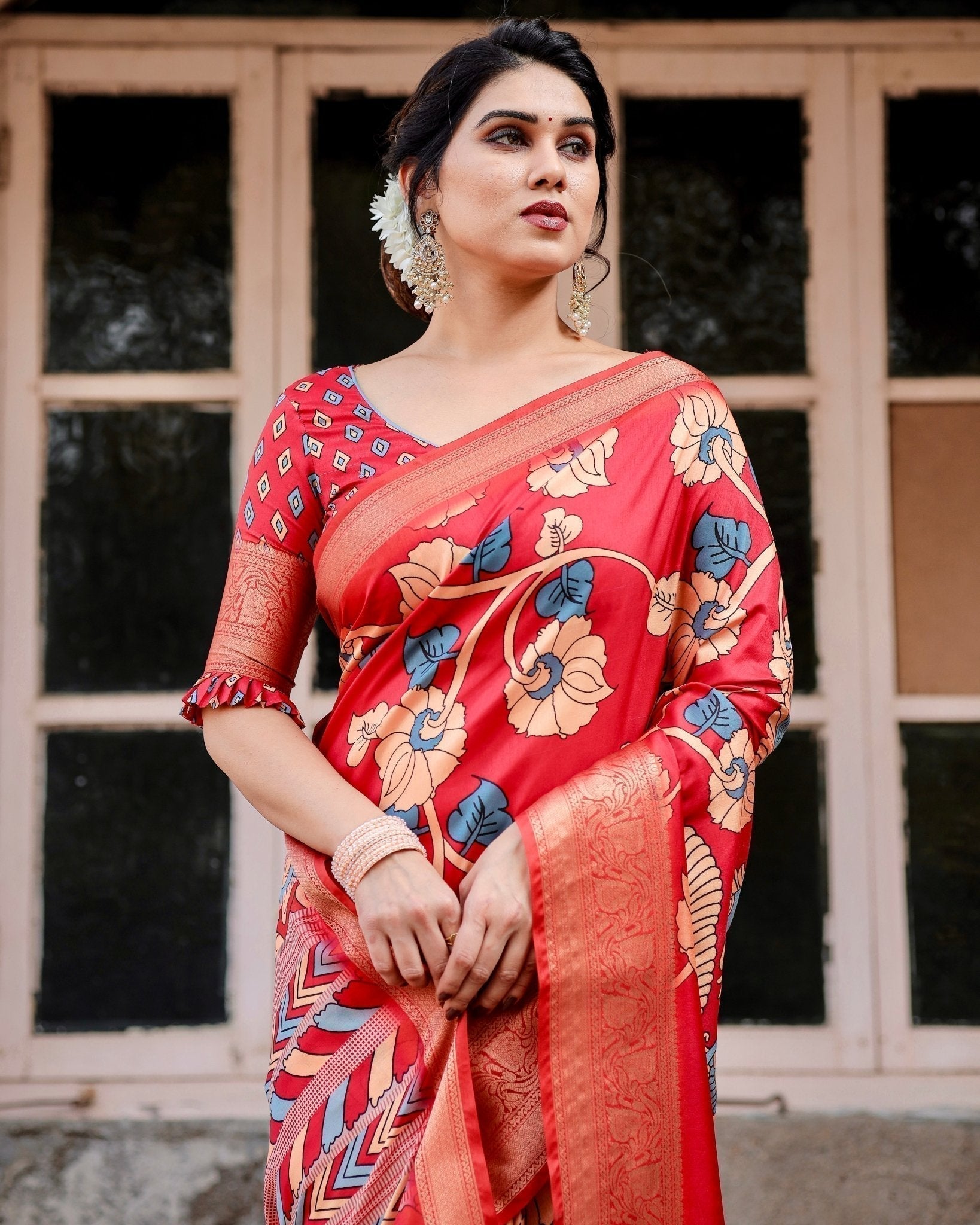 Vibrant Red Tussar Silk Saree with Bold Floral Motifs and Chevron Patterned Pallu