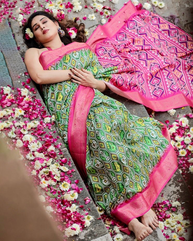 Green and Pink Tussar Silk Saree with Vibrant Ikat Patterns and Zari Border
