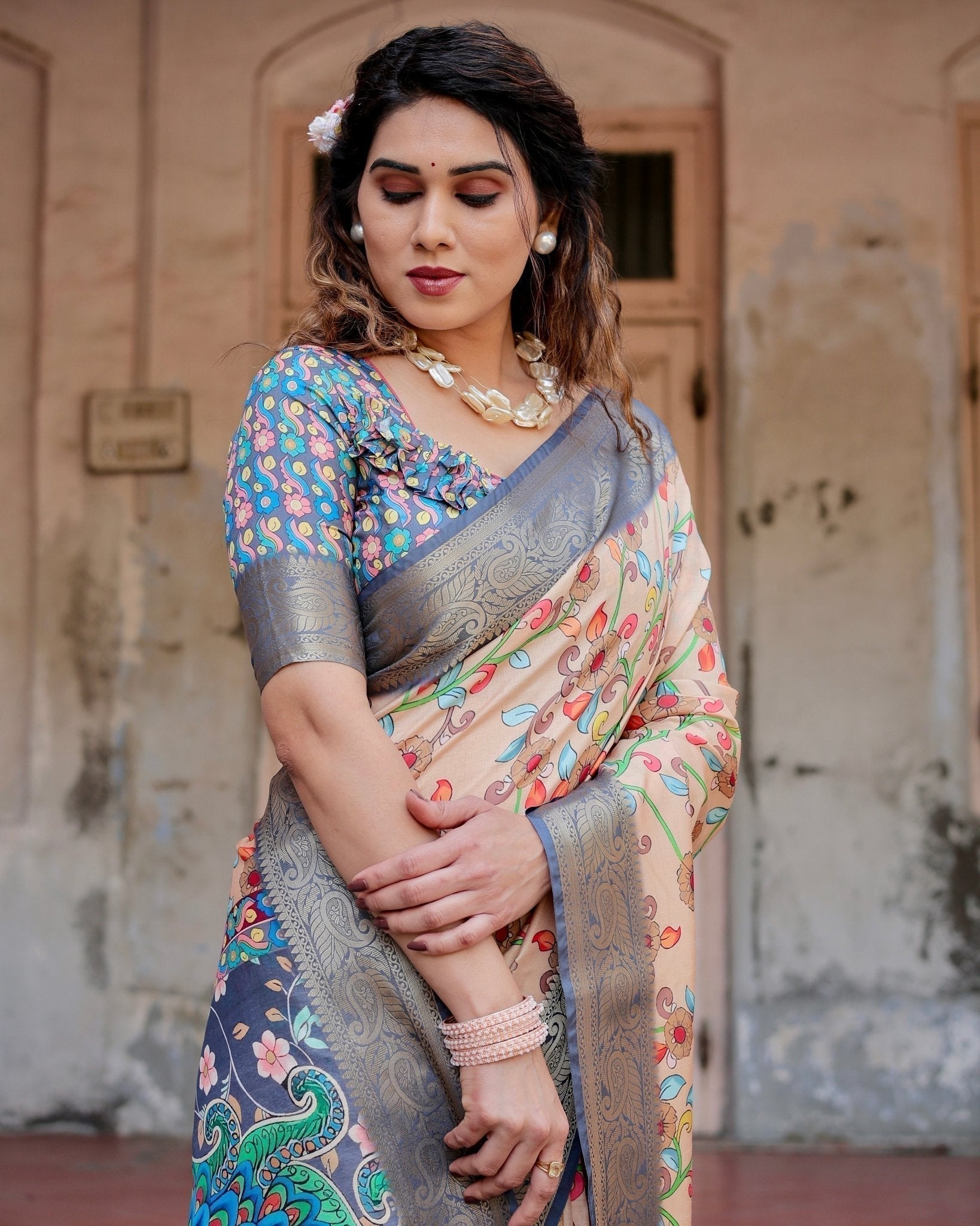Peach and Navy Blue Floral Saree with Vibrant Peacock Pallu and Tassel Detailing