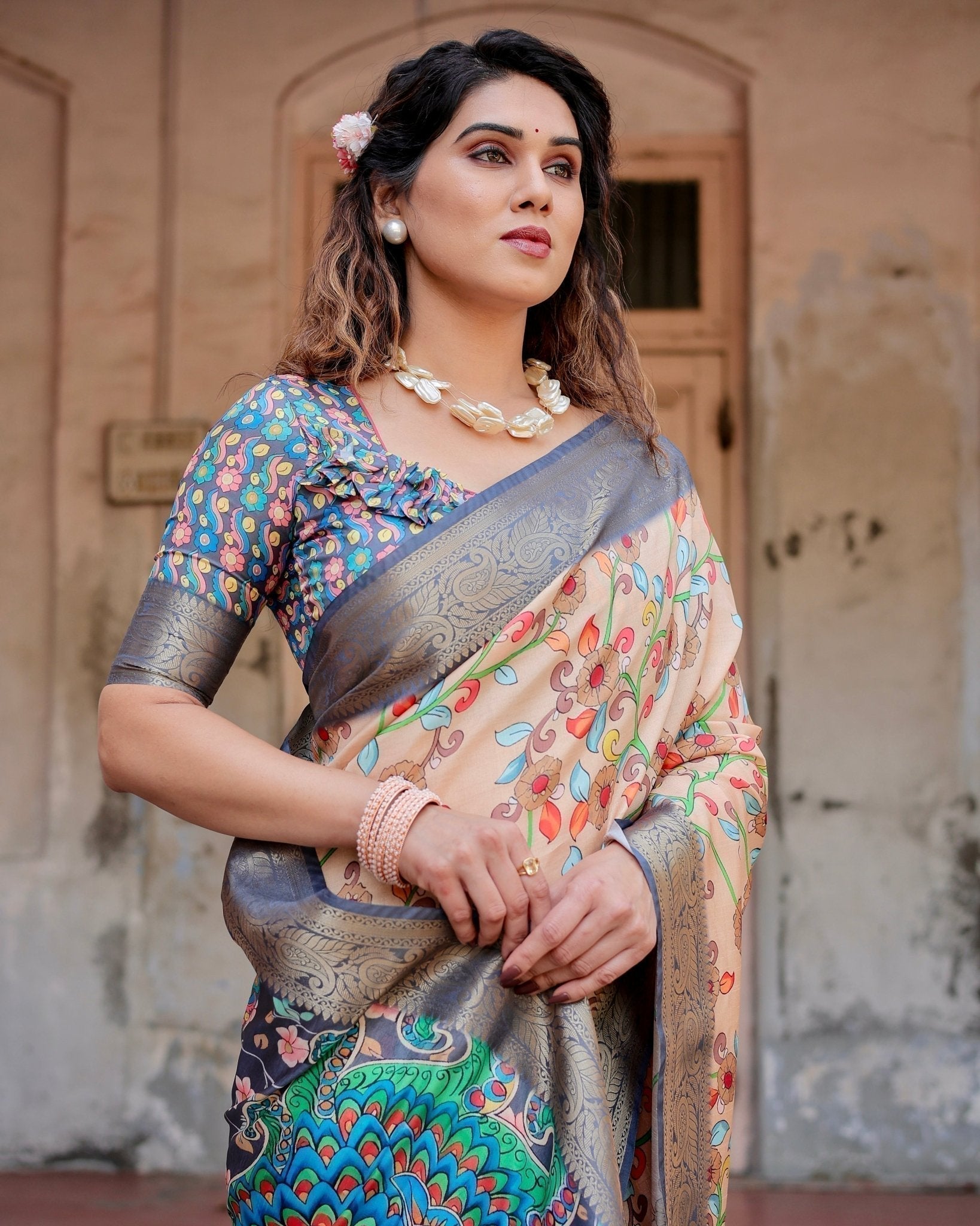 Peach and Navy Blue Floral Saree with Vibrant Peacock Pallu and Tassel Detailing