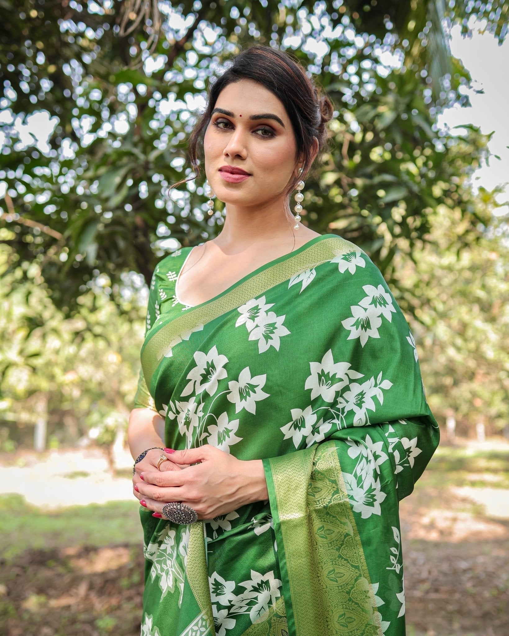 Enchanting Green Tussar Silk Saree with White Floral Prints and Zari Border