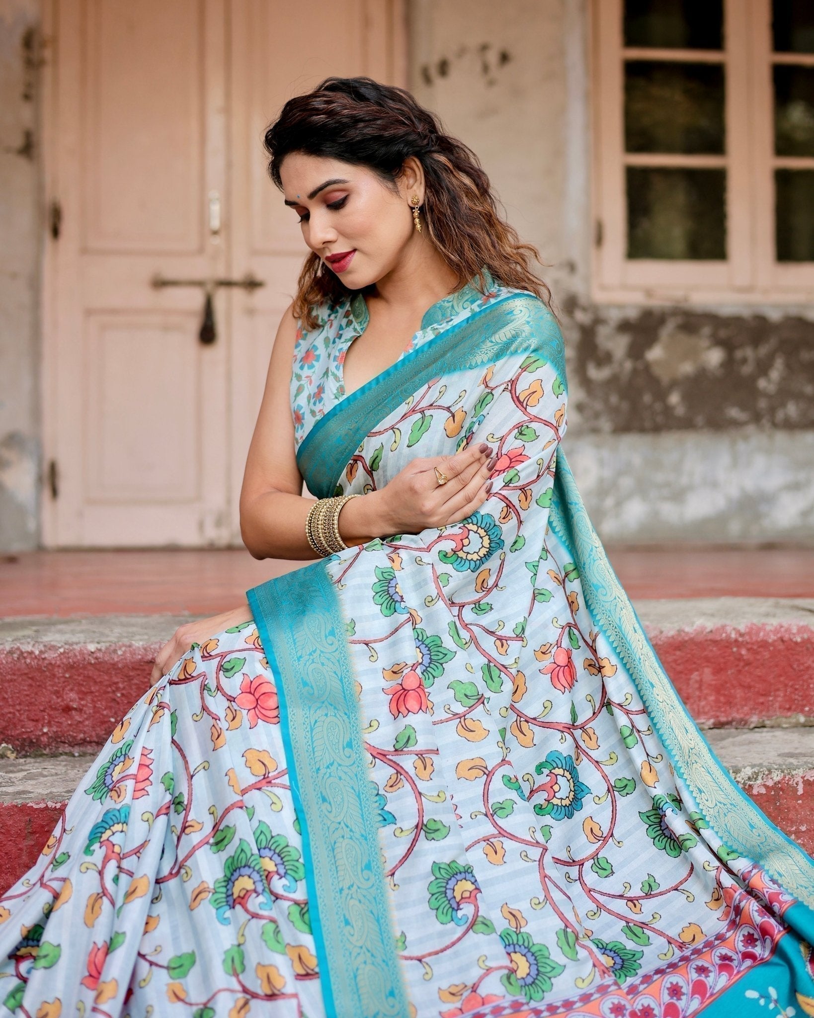 Sky Blue Tussar Silk Saree with Multicolor Floral Design and Zari Paisley Border